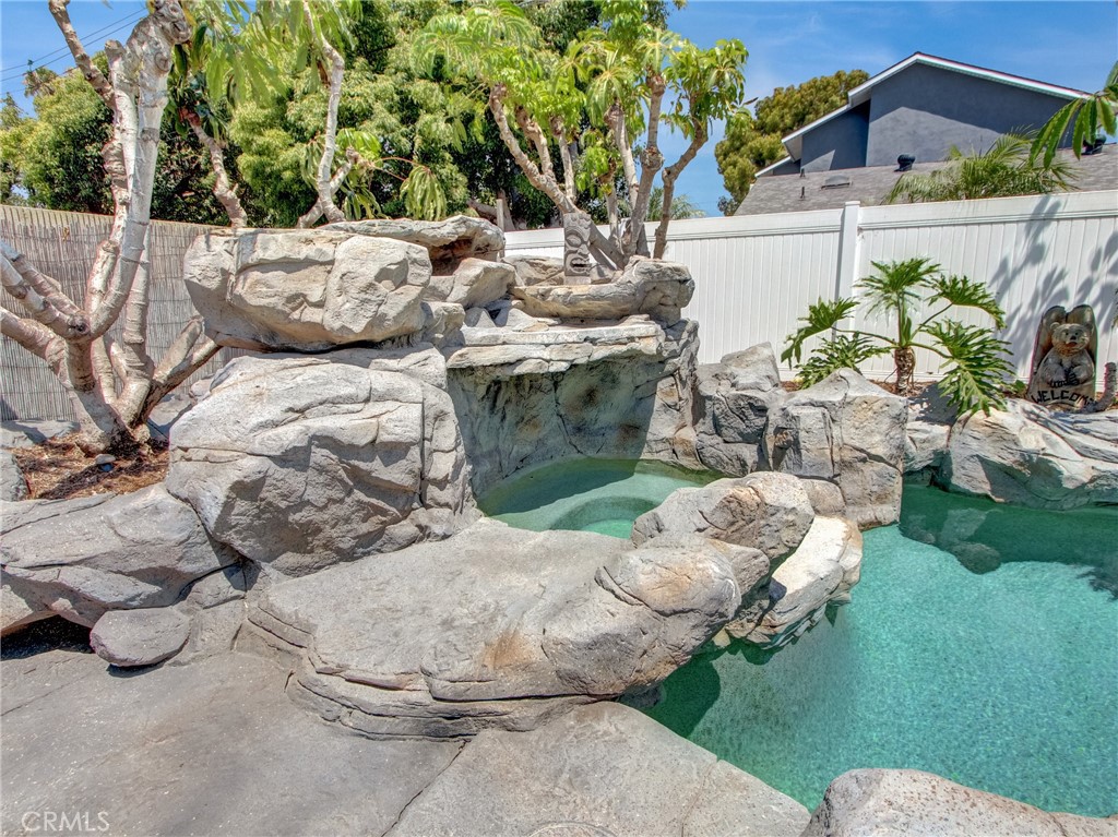 Nestled in the heart of Huntington Beach, this stunning rental home at 6241 Mar Vista Drive, 92647 offers an ideal blend of luxury upgrades and resort-style living. As you step inside, you're greeted by a spacious living room anchored by a cozy fireplace, setting a warm and inviting tone. The gourmet kitchen is a true centerpiece, showcasing granite countertops, modern cabinetry, stainless steel appliances, and recessed lighting—all flowing seamlessly into the open dining and living areas.
The home’s original four-bedroom layout has been thoughtfully transformed by combining two rooms to create an oversized master suite. This retreat features French doors that open onto the backyard, while the attached ensuite bathroom offers granite counters and an expansive walk-in shower—designed for everyday indulgence.
The backyard is your personal oasis: a resort-style pool with a waterfall and rock features, manicured putting green, lush landscaping, and an outdoor tiki bar complete with built-in barbecue—crafted for effortless entertaining or serene relaxation under the sun or stars.
Additional amenities include a detached two-car garage offering generous storage space along with a second refrigerator. Perfectly positioned within walking distance of the local mall, 5 miles from the ocean, and just minutes from major freeways, this home delivers both the ultimate Southern California lifestyle and practical connectivity throughout Orange County.