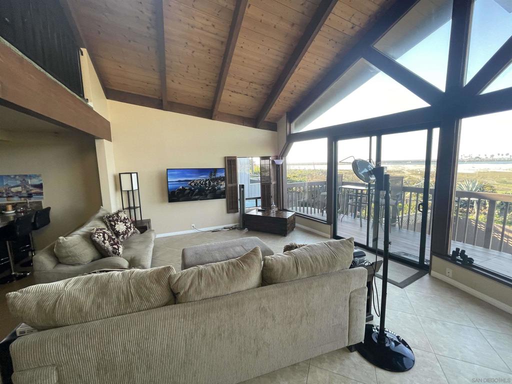 Beachfront house in Ocean Beach! This property is on the bike path near dog beach and has amazing views of the surf, ocean, and beach. It was completely remodeled less than four years ago with a massive custom shower, new kitchen, and stone tile. It has a gate that leads out the backyard onto the sand, and two master bedroom suites with private bathrooms and a large loft that could be used as an additional room, office, or den. The first floor has a two car garage and a large bedroom with massive shower and walk in closet. The second floor has the best views, and it has another master bedroom, the kitchen, living, and dining room with a fireplace. There is also a deck off the living room where you can sit and watch the waves. The large loft is on the third floor, and it has skylight and views of the water. Equipment: Garage Door Opener Sewer: Sewer Connected, Public Sewer Topography: LL