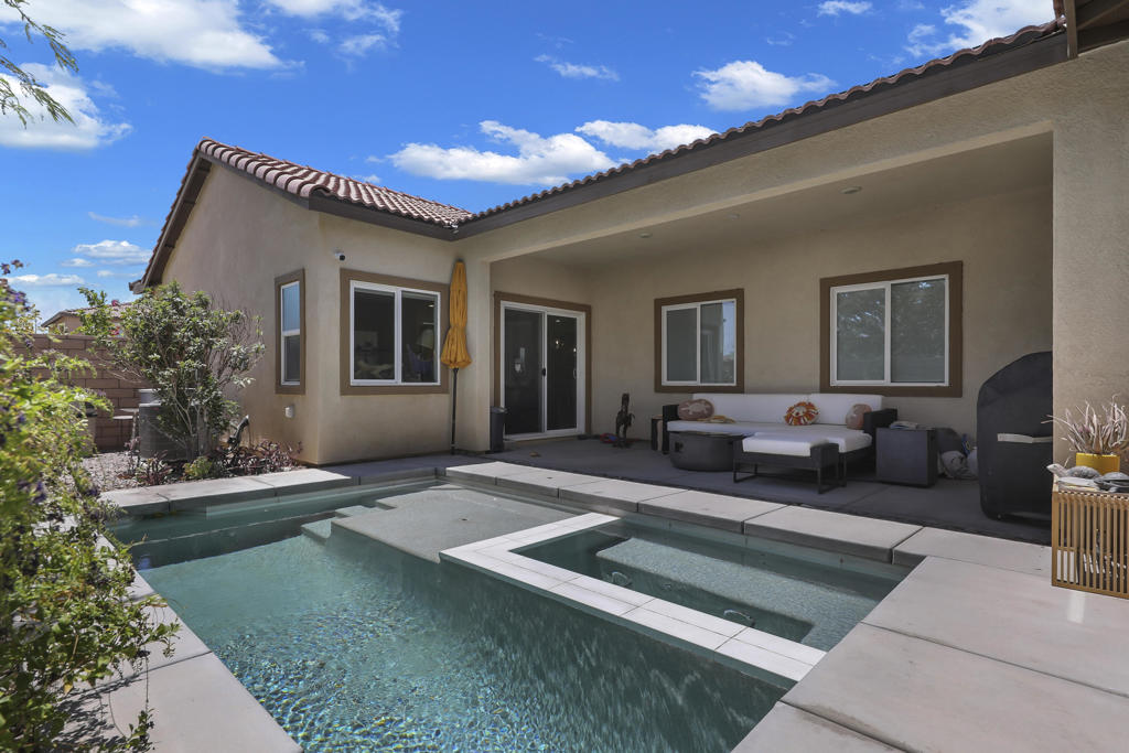 Private pool and spa on larger sized corner lot. Upgraded wood floors throughout. Larger builder floor plan with over 1,900 sq ft. Great location within the highly desirable community of Verano.Built in 2020, energy efficient, added additional solar, open kitchen, large primary suite and bath, walk in closet and shower, double sinks, and separate water closet. Cost efficient desert landscape and covered patio at pool/spa. Two car garage. Verano is a master planned community including community tennis/pickleball fitness center, park, pool, spa are all amenities included in the low HOA fee.