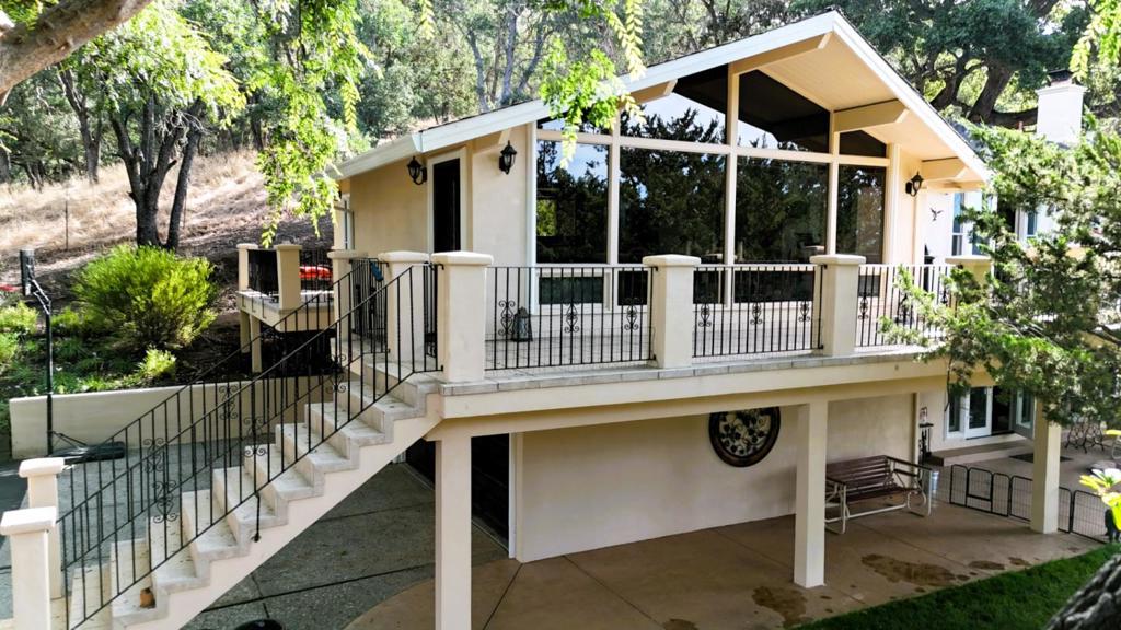 Dont miss this rare opportunity to own a unique country retreat on 4 oak-studded acres in the desirable west side of Morgan Hill. Set on an elevated parcel with sweeping views, this beautifully renovated 2,200+ sq ft home offers 3 bedrooms and 2.5 baths. The chefs kitchen features stainless steel appliances, rich custom cabinetry, granite slab countertops, and a walk-in pantry. The adjacent dining area flows into a vaulted living room with floor-to-ceiling windows framing breathtaking mountain and hillside vistas. The private primary suite offers wraparound balconies and a luxurious ensuite bath with leathered marble counters and a marble slab walk-in shower. The cozy lower-level family room features a rock fireplace with custom built-ins, a wet bar, and wine cellar, and opens to a spacious verandaideal for entertaining. The property includes two wells, barn/workshop, greenhouse, poultry coop, shed, and arena. Upgrades include Anderson wood-framed windows/doors, operable sidelights, hardwood floors, fully remodeled kitchen and baths, freshly painted exterior... And the list of improvements goes on. A truly exceptional property!