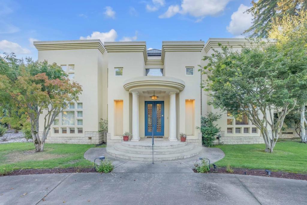 ATTRACTIVE SELLER FINANCING AVAILABLE TO QUALIFIED BUYER. Spectacular Custom Contemporary 6 bed/6.5 bath in highly coveted lower Hillsborough. Filled with natural light & clean line finishes, this spectacular property is set in a well-manicured verdant tree-lined large corner lot. Stunning architectural features of stately columns, soaring ceilings, and artful use of natural stones of marble, granite & sandstone set the tone for this sophisticated showcase of a home. The design and layout of this home epitomize California living at its finest. The open-flowing floor plan and strategically placed bedrooms, office areas and entertaining areas allow for an effortless combination of family living & entertaining. Boasts indoor/outdoor access to an extensive covered gazebo overlooking the fabulous level yard featuring a sophisticated pool and full workout room The chefs kitchen features a large center island, custom cabinetry, smooth granite counters, large stainless professional range, and flows into an inviting family/great room. The primary suite features a spa-like bath and large walk-in closets. Additional features of this fantastic home include electric gates leading to semi-circular drive and 4 car garage, expansive home office with custom built shelving and 2 media/ game rooms.