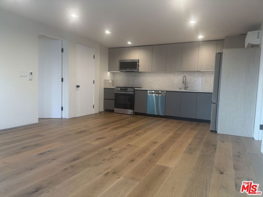 Experience refined Beverly Grove living in this brand new construction residence, ideally situated  on 4th Street between Sweetzer and La Jolla. This newly constructed lower level 2 bedroom 2 bathroom ADU offers approximately 917 sq ft with a thoughtful open layout and luxury with only one unit above. Be the first to live in this residence featuring modern finishes, custom kitchen cabinetry and counter tops, stainless steel appliances, recessed lighting, custom silhouette window treatments and much more. Both bedrooms are generously sized and complemented by spa inspired bathrooms and sleek fixtures. Generous in unit storage room, and individual split A/C systems provide personalized climate control in each room. This unit is set in a rear building with a secured gated entry which enhances privacy and security. Ideally  located in the heart of Beverly Grove, just steps from The Grove, Beverly Center, Trader Joe's, Whole Foods Market, Farmers Market, and many of Los Angeles' sought after dining places including Katsuya, Little Door and Joan's on Third. Close to Cedars-Sinai. Set on a quiet, permit-only street with ample street parking, this residence offers a blend of luxury and walkability in one of LA's most desirable neighborhoods.