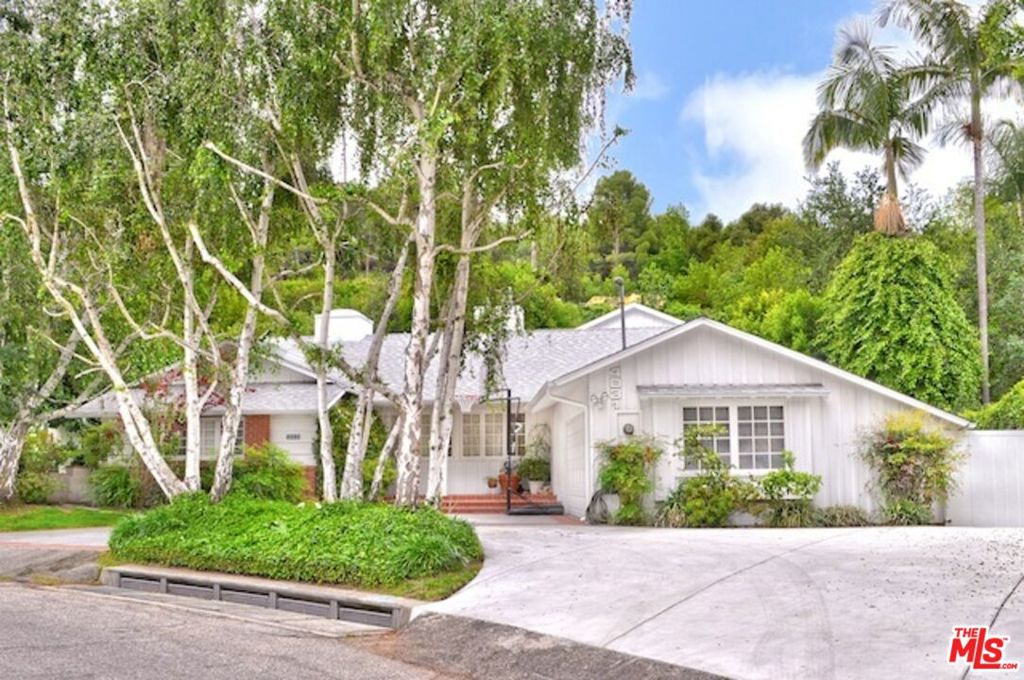 Terrific location south of Ventura Blvd. Spacious 5 bedroom and family room with 3112 sq.ft. Living and Family rooms with fireplaces, built-in book cases and custom lighting. Hardwood floors throughout. Formal dining room and very spacious kitchen with marble center island and breakfast area. Kitchen has top appliances including Subzero refrigerator, Wolf range and Miele dishwasher. Separate laundry area with Miele washer & dryer. Skylights and high ceilings. Master bedroom has private bath with dual vanities and glass shower with skylight. Glass doors open to private rear yard with salt water Pool & Spa (healthier than chlorine)! Beautiful indoor-outdoor flow from house to the garden. Very conveniently located to new high end Ralph's, Whole Foods & Erewhon Markets for shopping. Very close to Harvard-Westlake and walking distance to Buckley School.