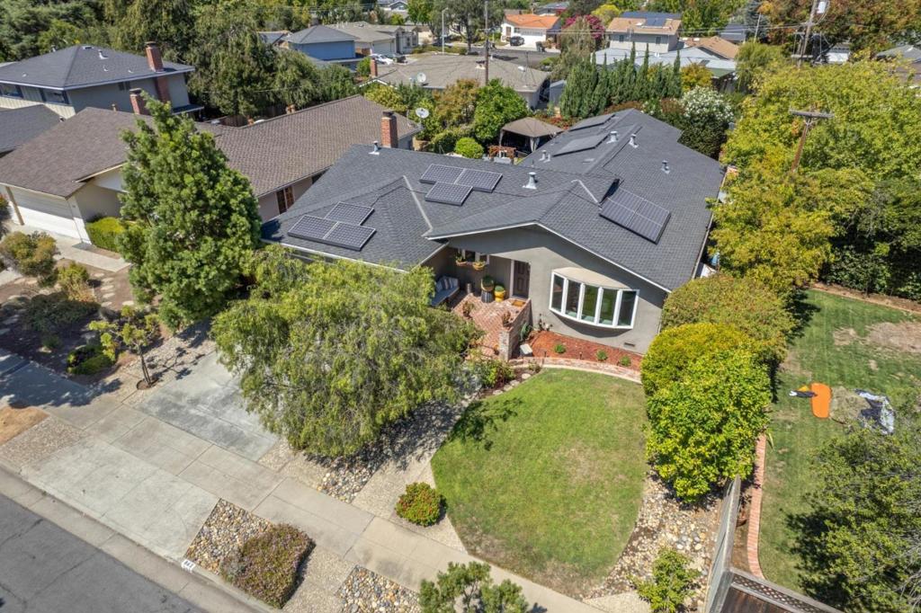 Welcome to 861 Flin Way, a stunning single-story Sunnyvale home offering over 1,900 sq. ft. of living space with 4 bedrooms and 3 bathrooms. Beautiful hardwood floors throughout create a seamless flow from room to room. The inviting family room features a cozy marble fireplace and opens to private outdoor spacesperfect for both relaxing and entertaining. At the heart of the home, the remodeled kitchen boasts stainless steel appliances, quartz countertops, and a full tile backsplash, flowing effortlessly into the dining area. The spacious primary suite includes a dedicated office/4th bedroom, a walk-in closet, and a remodeled bath. Two additional bedrooms share a stylish Jack-and-Jill bathroom with tile flooring and a walk-in shower. Modern upgrades include solar panels and a Tesla backup battery, offering both energy efficiency and peace of mind. Ideally located near Ortega Park, top-rated schools, and major employers such as Apple, LinkedIn, and Google, this move-in ready home combines comfort, convenience, and a bright open floor plan.