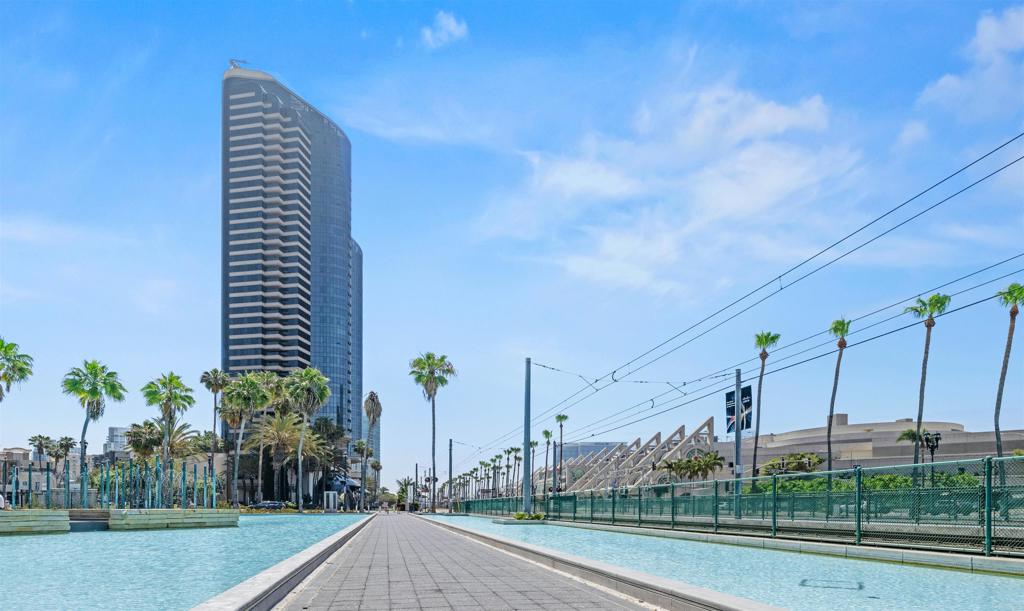 Welcome to sky-high living on the 30th floor — a rare vantage point in downtown San Diego. This west-facing residence offers sweeping views of San Diego Bay, Coronado, Point Loma, and stunning sunsets and city lights. Enjoy a spacious floor plan with a large living room, oversized primary suite, two full bathrooms, and a versatile second bedroom perfect as an office or den. Features include in-unit laundry, central A/C and heat, and a generous balcony for indoor-outdoor living. Located in a premier full-service building with 24/7 attended lobby, gated garage with two side-by-side parking spots and two storage bins, plus resort-style amenities: pool, hot tub, gym, sauna, BBQs, clubhouse, and library. Just steps from the Convention Center and waterfront, this is luxury, lifestyle, and location all in one. Come for the views, and stay for the lifestyle. Or come for the lifestyle, and stay for the views. The choice is yours.