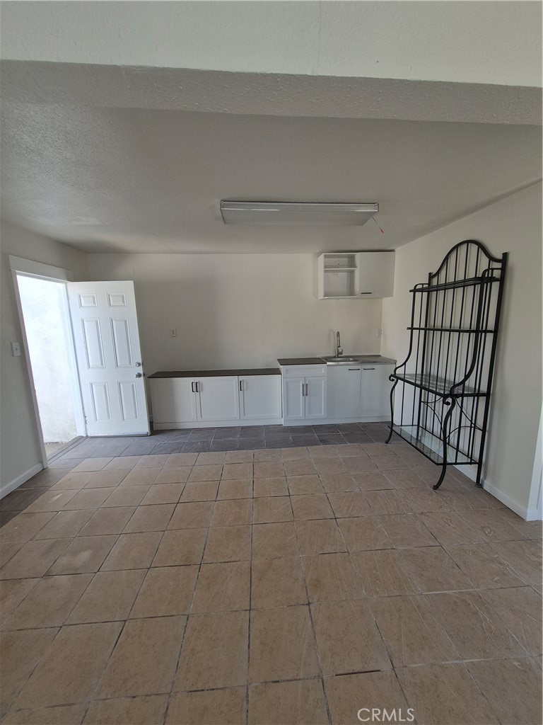 Private studio located at the rear of the property, offering a quiet and comfortable space with its own entrance and essentials amenities. Ready to move,
included parking for two vehicles. Utilities included.
