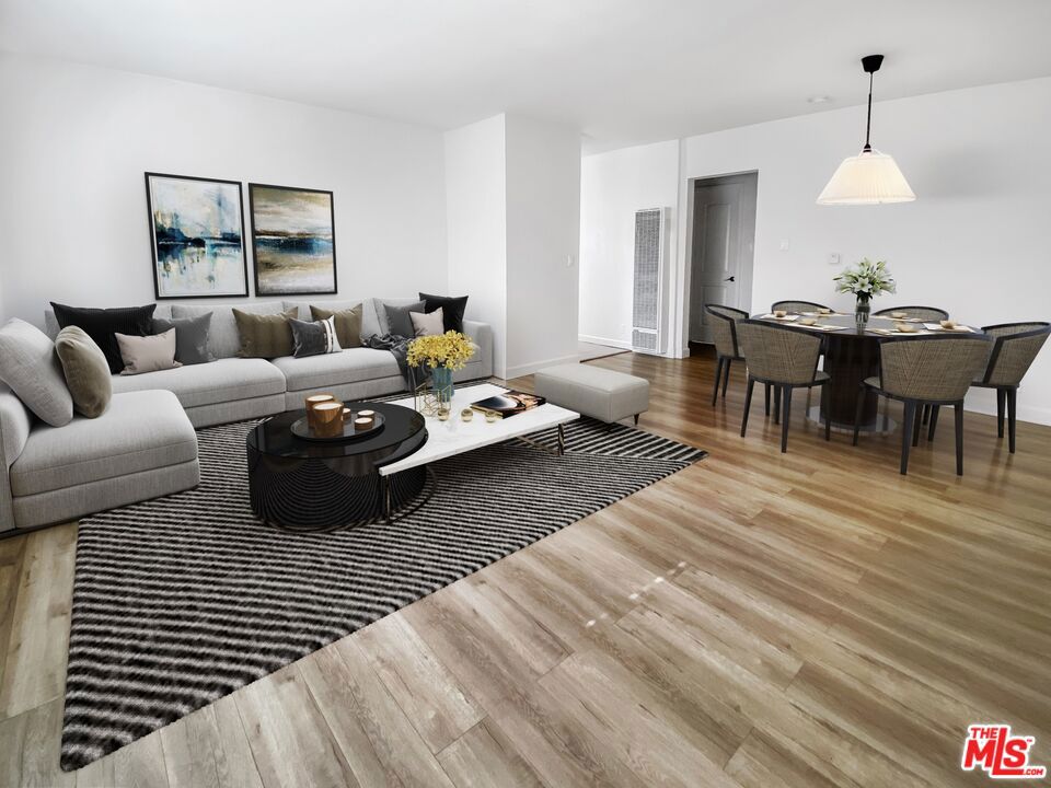 Tastefully remodeled 2BR in the heart of Los Angeles with easy 10 Fwy access. Building has undergone major renovation with new plumbing, electrical & roof. Unit features grey laminate floors, espresso shaker cabinets, quartz counters, faux wood blinds & stainless steel appliances (fridge, range/oven, dishwasher, microwave). On-site laundry, 1 assigned parking & storage. Pride of ownership! Tenant occupied, available mid-Sept.Unit photos are virtually staged.