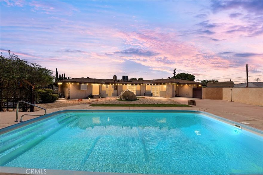 Discover this expansive and one-of-a-kind residence nestled on Riverside Drive one of the most desirable locations in the High Desert. This home offers incredible potential to create your dream retreat.

Enjoy outdoor living at its finest with a fully equipped outdoor kitchen, perfect for entertaining family and friends. Cool off in the inviting pool or relax in the enclosed patio, providing a private oasis to un wind year-round. 

Located directly across from the riverbed, you'll appreciate the tranquil views and natural surroundings. 

Zoned for horses and adjacent to scenic horse trails, this property is ideal for equestrians or anyone seeking a rural lifestyle with plenty of outdoor space. The large lot provides ample room for riding, stabling, and outdoor activities. 

Located in a sought after school district, this home combines rural charm with convenient access to education and community amenities. Whether you're an equestrian enthusiast , someone looking for a unique property with great potential, or simply seeking a peaceful setting, this Riverside Drive estate has it all.