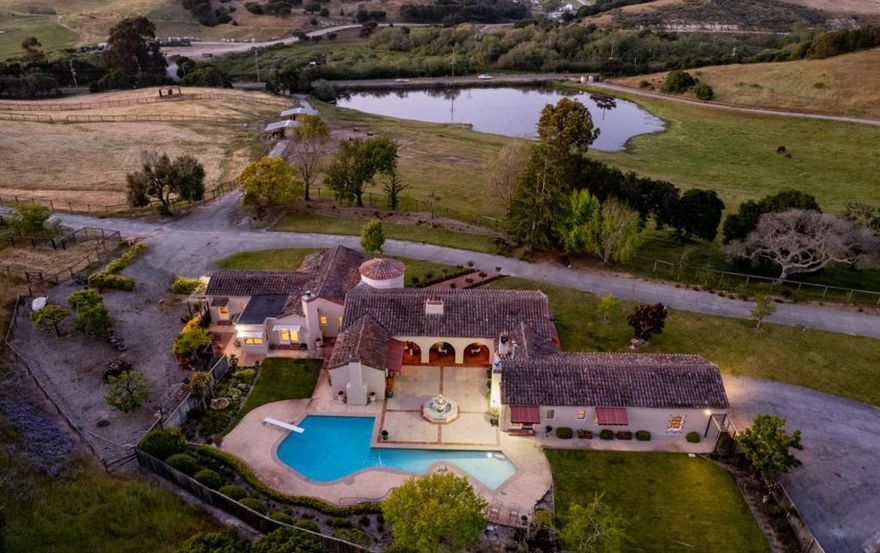 1014 Monterey Salinas Highway is a once in a generation opportunity. With a beautiful home spanning 4,000+ ft and 50 acres of land, minutes from Monterey, Carmel, Pebble Beach, Salinas, and the Monterey Airport, Villa Munras is one of a kind. The property abuts over 150 acres of non-profit owned land to the East and another horse property to the West, providing perfect privacy. The expansive Spanish home embraces timeless style with a contemporary approach, as every bedroom enjoys an ensuite bathroom, while still having 2 powder rooms for guests. The remodeled kitchen is complemented with high end appliances, natural light, and easy access to the backyard entertaining space with pool. With 8 stalls in two barns, grain storage and several amply sized pastures, the grounds have been designed to accommodate a number of horses on the property. It is hard to imagine a property more geared for equestrian life with such direct access to convenience.