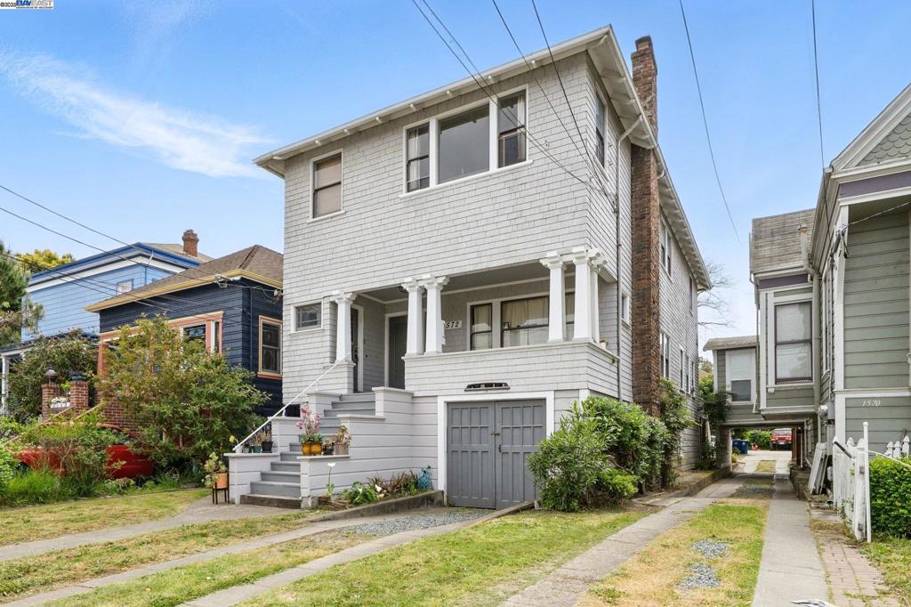 Welcome to 1572 and 1572 1/2 Lincoln Ave, a unique and income-producing fourplex located in the heart of Alameda. Set on a 6,175 square foot lot, this 3,388 square foot property features a rare standalone 2-bedroom, 1-bathroom cottage that has been partially updated with new flooring, fresh paint, and modern light fixtures. With its own dedicated parking, the cottage offers the perfect blend of privacy and convenience—ideal for an owner-occupant or as a premium rental unit. The main building includes three additional units: a spacious 2-bedroom, 1-bathroom apartment, a well-proportioned 1-bedroom, 1-bathroom unit, and a cozy studio. All residents benefit from access to an on-site laundry room, adding an extra layer of functionality to the property. Located near Park Street’s shops, restaurants, and easy access to public transportation, this well-maintained fourplex is perfect for investors looking for solid cash flow or buyers seeking a hybrid opportunity to live and earn in one of Alameda’s most desirable neighborhoods.