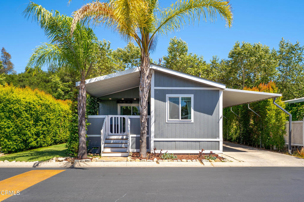 Welcome to Ojai Oaks, an all-age community offering wonderful amenities including a sparkling pool, clubhouse and game room. This beautifully maintained 2-bedroom, 2-bathroom manufactured home features 1,200 square feet of comfortable living space and has been thoughtfully updated throughout.Inside, you'll find a modernized kitchen with butcher block counters, newer appliances, and wood-like flooring. The open layout is bright and inviting filled with natural sunlight. Dual-paned windows and central A/C keep this home cool in the summertime, for year-round comfort! Enjoy a spacious backyard, boasting a covered back patio complete with slate floors, pull down shades, ceiling fans, low-maintenance synthetic grass, and mature landscaping creating a true retreat! The property also includes a long carport, large lofted shed for storage and a fenced pet area. The front porch is currently used as a home gym, but could easily be reimagined as another outdoor living space to lounge, enjoy a cup of coffee in the morning or enclosed and made into a third bedroom. Located less than 4 miles to downtown Ojai and just 12 miles to Ventura Pier and downtown Ventura. Don't miss the chance to live in this welcoming community with fantastic amenities--schedule a showing today!