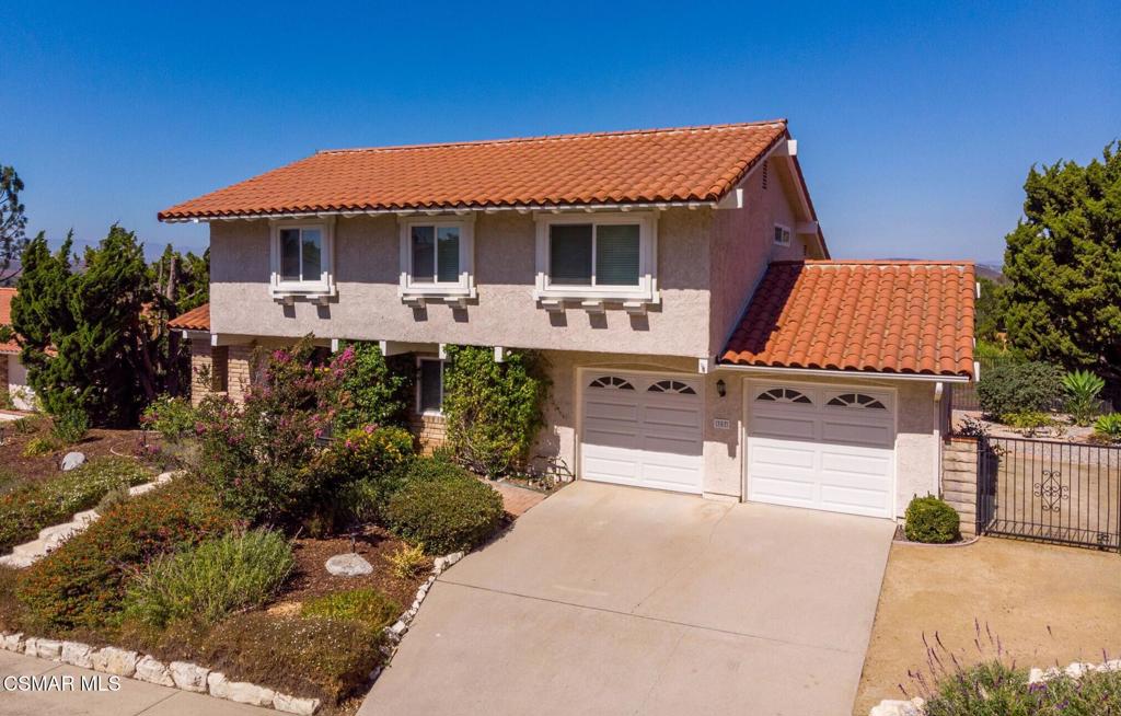 VIEWS VIEWS VIEWS! Located on the crown of Hickory Grove Drive, in the desirable Lynn Oaks tract, this four bedroom, three bathroom home has unprecedented panoramic views of the Conejo Valley and surrounding wildlife. The open floorplan includes living room with vaulted ceiling, formal dining area with direct access to the backyard, and a downstairs bedroom. The kitchen was updated with oak cabinetry, recessed lighting and beautiful views from the garden window. There is a separate family room with large sliding glass doors bringing the outdoors in. Upstairs are three additional bedrooms including the primary suite with a walk in closet and direct access to attic storage space. Features include inside laundry room with washer & dryer, newer HVAC and dual pane windows. Enjoy endless views and breathtaking sunsets from the beautifully landscaped backyard with paver stone patio, patio cover, grass area and a colorful variety of flowers and plants. Attached two car garage and possible RV access. Located around the corner from a beautiful park and close proximity to shopping, restaurants and freeway access. This well loved home has been meticulously maintained and is ready for your cosmetic updates to make it your own.