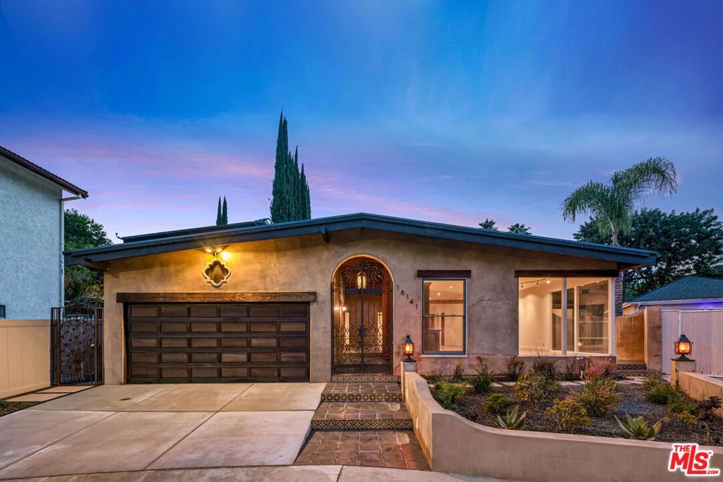 Nestled in the exclusive Royal Woods neighborhood of Sherman Oaks, this beautifully reimagined 4-bedroom, 5-bath Spanish-style home offers privacy, character, and exceptional indoor-outdoor flow. Located south of Ventura Blvd, the residence showcases warm luxury with vaulted ceilings, rich woodwork, and an open layout ideal for entertaining.The chef's kitchen features custom cabinetry, high-end appliances, a spacious pantry, and a pass-through window to the patio for effortless alfresco dining. French doors open to a lush, private backyard oasis with mature landscaping, built-in seating, fire pit, and a solar-heated triangle pool with peaceful canyon views. The primary suite is a true retreat with cedar vaulted ceilings, Brazilian cherry floors, a massive walk-in closet, and a spa-like bath with jetted tub and bidet. Three additional en-suite bedrooms, a light-filled bonus room, and a flexible layout offer space for both relaxation and entertaining. An attached garage, generous storage, and charming architectural details throughout complete this special offering. A rare and soulful home built for both comfort and inspiration.