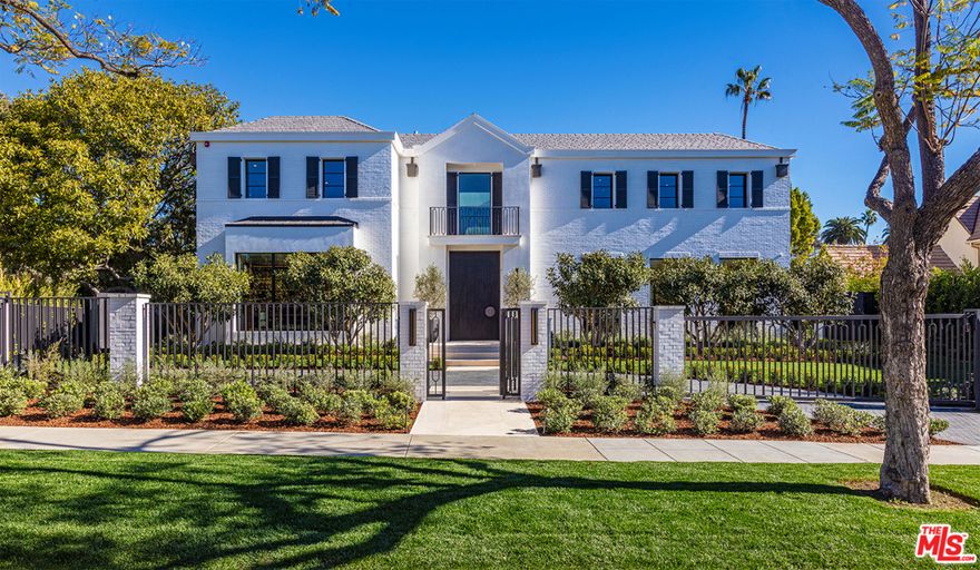 Behind the gates & lush landscape in the coveted Beverly Hills Flats, this brand-new Hamptons-inspired modern w/ a 5-car subterranean garage is the culmination of privacy, style & entertainment near Rodeo Dr & other world-class destinations. Perfect indoor/outdoor lifestyle awaits in an L-shaped estate w/ exquisite walnut wood paneling & Hermes leather backdrop, overlooking an expansive pool. Formal living, dining & office are framed by glass sliders showcasing a custom-built outdoor entertaining area w/ BBQ/ bar & pool/spa. Rarely does a home embody both warmth & modern aesthetics & provide social & family possibilities. Chefs kitchen & an oversized glass wine cellar fulfill culinary ideals. Downstairs is an entertainment oasis w/ soaring 11 ft ceilings, glowing marble wine wall, bar, theater w/ blue leather seats, gym w/ sauna & massage. Upstairs boasts study & 5 bedrooms including a sumptuous primary suite w/ marble baths w/ soaking tub. The ultimate entertainers dream home.