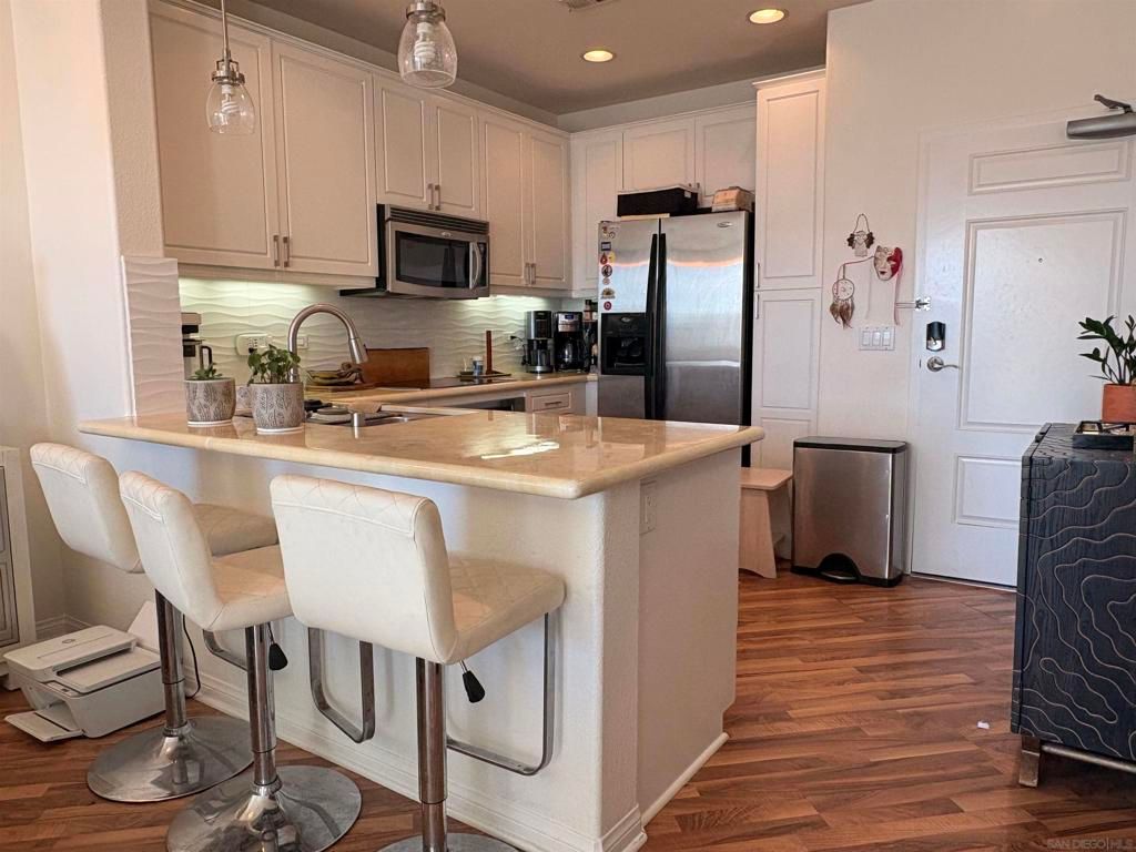 Photo of 3887 Pell Place Pl #229, San Diego, CA 92130 (MLS # 250044830SD)