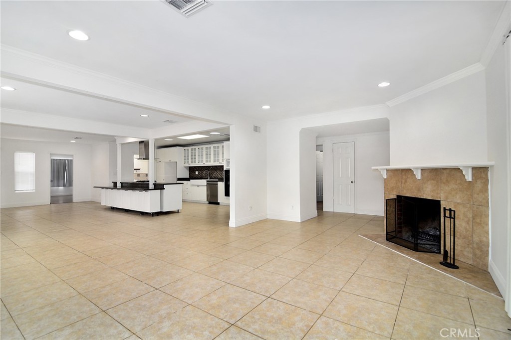 An incredible opportunity in the heart of it all, welcome to this single level sensation directly on the border of Tarzana. Light and bright with a wide open floor plan. From the moment you enter, open views to every major living space are in your direct line of sight. A formal living room with gas fireplace welcomes you as you make your way through the front door. The grand sized kitchen has a plethora of cabinet and counter space while offering a massive center island, granite countertops & stainless appliances. A formal dining area sits directly in front of the kitchen while a separate but open family room is adjacent. A huge master suite sits at the back of the home and features its own updated en-suite bathroom. There are 3 additional guest bedrooms inside, two of which share a full hall bathroom while the fourth bedroom also offers direct access to a bathroom. Make your way outside to find a detached garage that has been converted to living space with an attached bathroom. Nearly 400 additional square feet of space that is NOT INCLUDED in the total square footage or bedroom/bathroom count. Therefore, the main house is 4 bedrooms + 3 bathrooms offering 2,357 sq. ft., plus there's an additional roughly 400 square feet of space being utilized by the converted garage. Easy alley access with still plenty of room for parking inside the gate. Additional upgrades include recessed lighting, smooth ceilings, double pane windows and a fresh coat of paint. Not only would this home be great for any end user but it also has tremendous upside potential for investors looking to use the home for an assisted living facility, rehab or any other type of income producing poroperty.
