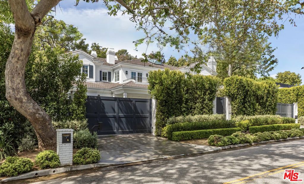 This private estate in the highly coveted lower Mandeville Canyon offers the rare tranquility of canyon living paired with the scale, privacy, and amenities of a true retreat just minutes from the best of the Westside. Upon arrival of this exceptional 2020 build, enjoy serene privacy with towering ficus trees and a secluded driveway. Inside, soaring double-height ceilings and expansive rooms create an atmosphere of grandeur, while lush green landscaping is visible from nearly every window. The main floor features a formal living room, dining room, home office, and an open-concept family room and kitchen with pocketing doors that seamlessly connect to the spacious backyard. The outdoor space is complete with a pool/spa combo, outdoor fireplace, overhead heat lamps, BBQ, and dining area. The lower level is just as impressive, boasting a large family/game room, wine cellar, custom bar, gym, theater, guest bedroom, and a bonus arts and crafts room with its own outdoor patio and stairway leading to the backyard and pool area. Developed by Fountainhead Homes, who are widely regarded for their commitment to the highest standards of building, this one of a kind estate is a true sanctuary in one of the city's most coveted neighborhoods.