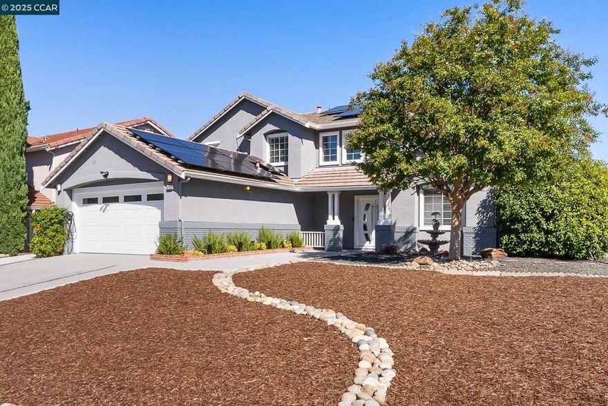 Unforgettable and truly one-of-a-kind, this modern Antioch home blends high-end design with everyday comfort. Set on a spacious 9,500 sq. ft. corner lot, with 4 bedrooms and an office, every inch has been thoughtfully upgraded with quality materials and smart features.  Inside, you’ll find real hardwood floors, a custom wrought-iron staircase with hidden under-stair storage and fresh designer interior and exterior paint. Natural light pours in through new skylights along with new recessed lighting, creating an open, airy feel throughout.  Luxury touches include heated marble bathroom floors, a striking stacked-stone fireplace, and a finished garage with durable epoxy flooring. Comfort and efficiency go hand in hand with a new high-efficiency HVAC system (all electric) and leased solar panels. Outdoors, a pre-installed capped gas line is ready for your future fire pit or outdoor kitchen—perfect for entertaining.  Beautifully upgraded, energy-smart, and designed for modern living—this home is as stylish as it is functional.