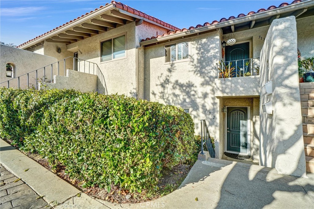 Move-In Ready Condo in the Prestigious West Nine Community of Laguna Niguel. Enjoy coastal living at its finest in this beautifully updated 2 bed, 2 bath condo with a detached 2-car garage. Located in the highly sought-after West Nine community, this home offers new interior paint, wide plank vinyl flooring, and abundant natural light. The remodeled kitchen opens to a separate dining area and spacious living room with patio access—ideal for entertaining. The primary suite features dual closets, a walk-in shower, and private patio access. Exterior laundry closet included. Relax on your private patio with lush landscaping and peek-a-boo views of El Niguel Country Club and Laguna Niguel Racquet Club. Just minutes from Monarch Beach, Dana Point, hiking trails, shopping, dining, and with easy access to PCH.