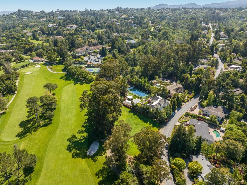 2205 Skyfarm Drive represents one of the final estate-sized building sites in the prestigious Country Club Manor. This 0.825-acre parcel is notably level and flat, positioned in the prime and sought-after area of Hillsborough. The property's backyard borders the Burlingame Golf and Country Club, enhancing its appeal. Oriented to the northwest, the lot is protected by numerous original heritage trees, contributing to its privacy and charm. This offering is a rare opportunity to construct the estate of your dreams. The seller has a boundary survey and conceptual home designs on file. Proximity to Eucalyptus, along with nearby Burlingame restaurants, stores, and boutiques, adds to its desirability.