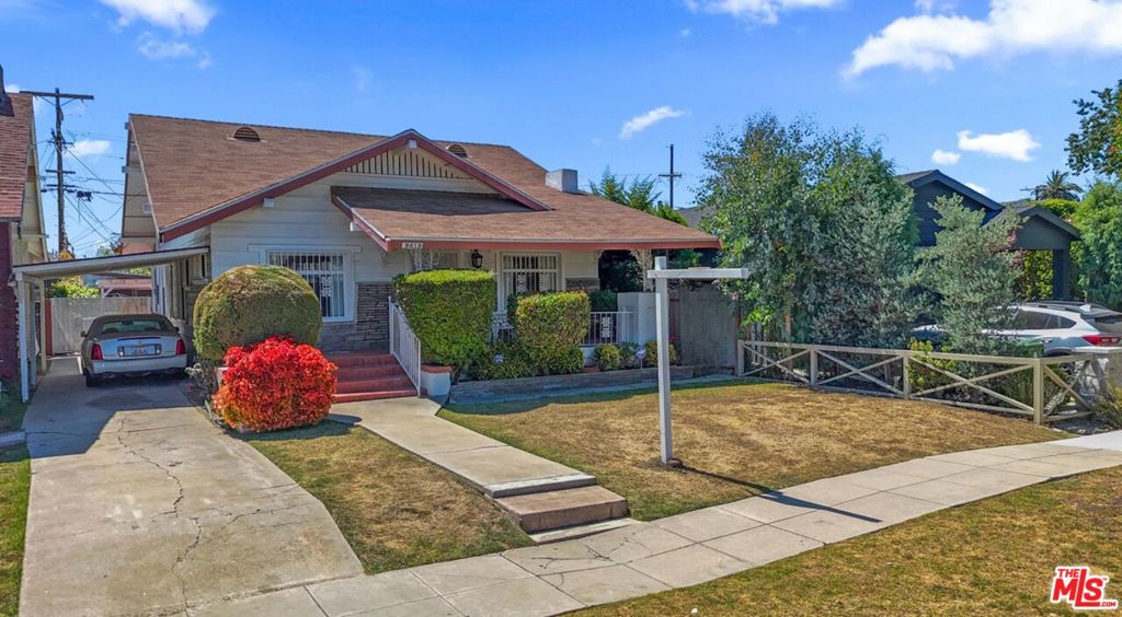 Experience classic charm in this versatile 1913 California Craftsman located in Jefferson Park. This spacious 2 bedroom + 1 bathroom with a sizeable Den that could be used as a 3rd bedroom. Lovely open living with fireplace that flows to the dining room. This home has hand crafted details galore, built in cabinetry and shelfing, wide wood trim molding throughout and a large front porch. Gracious kitchen with eating space. This home has newer roof, cooper plumbing, many newer windows, Large carpeted attic with ceiling fans, long driveway with carport, reck room unpermitted used as storage.