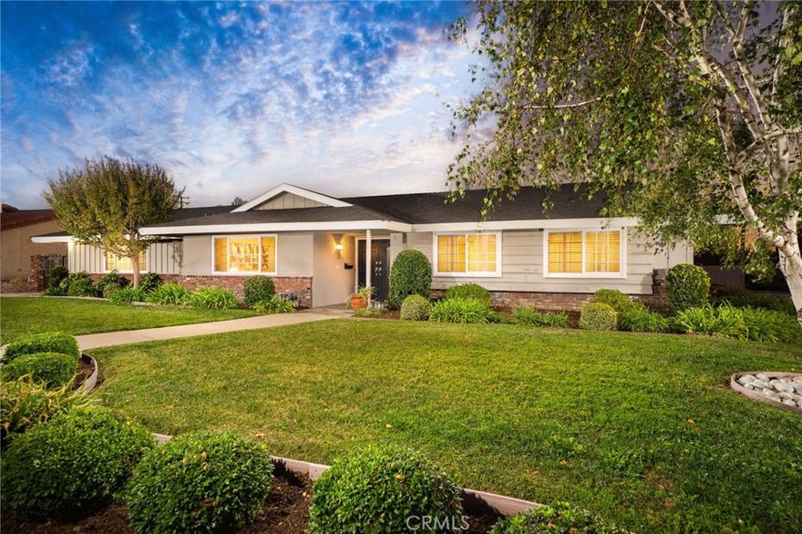 Welcome to this beautifully updated and meticulously maintained four-bedroom, 2.5-bathroom family home, perfectly situated on a spacious corner lot in a peaceful cul-de-sac in the highly sought-after North Glendora Springs neighborhood. Offering 2,080 square feet of comfortable living space on an expansive 12,402-square-foot lot, this home combines timeless style with modern upgrades. A charming covered front porch leads into the inviting formal entry and step-down living room, where a large picture window frames picturesque mountain views. The open-concept kitchen features white cabinetry, granite countertops, and premium Thermador stainless steel appliances, flowing seamlessly into the family room/great room with a cozy brick fireplace, elegant white wood mantle, and sliding doors to the backyard, perfect for entertaining or relaxing. The primary suite offers direct access to the backyard, two mirrored closets, a vanity area, and an en-suite bathroom with a separate shower. Three additional well-sized bedrooms share a full hallway bath with dual sinks and a tub/shower combination. Additional conveniences include an indoor laundry room, powder room, and an oversized two-car attached garage with direct home access and an extended parking area. Recent upgrades include: newer composition roof, dual-pane windows, copper plumbing, recessed lighting, 200-amp electrical panel, plantation shutters, newer vinyl flooring and newer carpet. Step outside to enjoy a beautiful backyard with a covered patio, fire pit, and a pool-sized spacious lawn area with artificial turf and a separate space ideal for a children’s play structure or garden. Located within walking distance of Glendora High School, Goddard Middle School, and Sellers Elementary, this home offers the perfect combination of location, comfort, and style. Don’t miss this wonderful North Glendora opportunity!