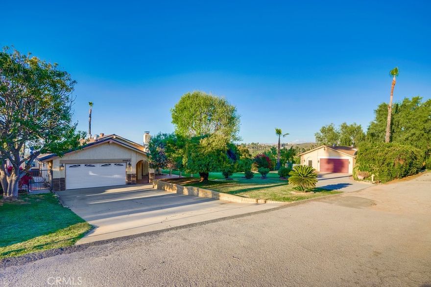 Discover the perfect blend of peaceful country living and investment potential!

Nestled in a quiet and safe neighborhood, this property offers two separate units on one lot, surrounded by open land and longtime friendly neighbors — an ideal retreat from the city bustle, unbeatable value for a dual-unit property with solar, EV charging, and smart tech features!

Property Features:

Main House: Approx. 2,507 sq.ft., 3 bedrooms, 2 bathrooms — spacious, bright, and move-in ready.

Second Unit: Approx. 1,200 sq.ft., 3 bedrooms, 1 bathroom — private entrance, great for extended family or long-term rental income.

Includes two additional vacant lots at no extra cost, offering endless potential for gardening, planting, or even future expansion.

Option to purchase an extra adjacent parcel at a discounted $20,000 package price — a rare opportunity for investors or nature lovers!

Lifestyle & Location:

Enjoy a tranquil lifestyle with plenty of open space, fresh air, and quiet surroundings.

Perfect for anyone seeking privacy and peace while staying within a short drive to city conveniences.

All surrounding homes are owner-occupied and well maintained, offering a safe and welcoming environment.