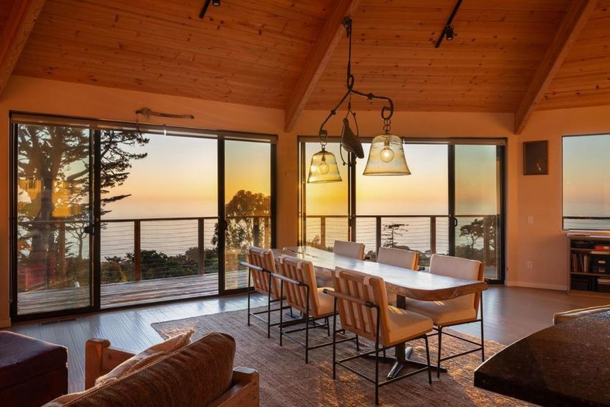 "Misty House", long celebrated as an artist's haven, is defined as much by its unique history as it is by its panoramic white water views. It was once the home of Johnny Adams, a local disc jockey whose deep connection to the world of jazz music ultimately inspired Clint Eastwood's first directorial project, Play Misty for Me.  Perched on a Carmel Highlands hilltop overlooking the Pacific, this mid-century modern residence is an architectural marvel. In 2016, Studio Carver Architects remodeled it down to the studs, creating an inviting open layout with grand 16ft ceilings and floor-to-ceiling windows throughout. The main level features two bedrooms and two bathrooms, with the kitchen and great room connecting to a wrap-around deck high above the bay showcasing incredible views to Point Lobos and south toward Big Sur. The lower level has a separate entrance, making it a perfect third bedroom for guests, a home office, or a studio complete with a darkroom for traditional photography.  The property boasts excellent infrastructure, including owned solar, air conditioning, and a robust driveway built to withstand the elements of Highlands living. This is truly a slice of Big Sur with the convenience of Carmel just 10 minutes to town.