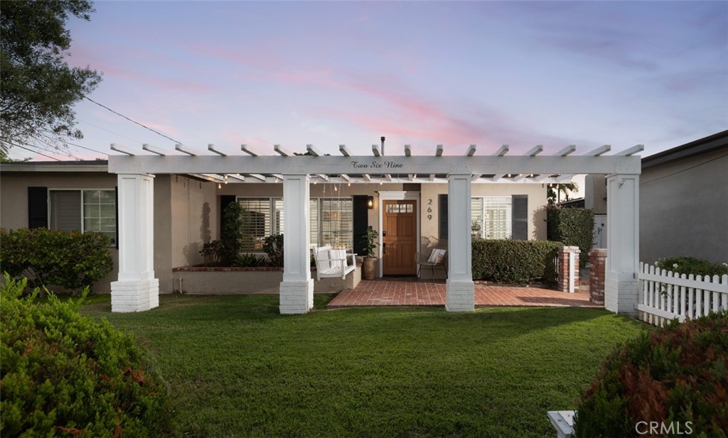 Welcome to 269 Cecil Place, Eastside Costa Mesa. This exceptional single-level residence offers 4 bedrooms and 2 bathrooms, ideally situated on a quiet, premium street in one of Costa Mesa’s most sought-after neighborhoods.
Framed by a charming white picket fence, mature olive tree, and an inviting shaded front porch with swing, the home exudes timeless curb appeal. Step inside through the Dutch door to discover a bright, open-concept layout designed for modern living. The kitchen showcases custom built-in banquette seating, quartz countertops, shaker cabinetry, farmhouse sink, and stainless steel appliances—perfectly blending style and function.
Additional highlights include central heating and air conditioning, recessed lighting, and luxury vinyl plank flooring throughout much of the home. A spacious permitted family/TV room addition (2005) enhances the living space, while the expansive backyard is designed for quintessential Southern California entertaining. Enjoy the oversized spa (“spool”), built-in BBQ with bar seating, fire pit, and plenty of room for outdoor dining, lounging, and play—complete with fruit trees and lawn space.
The garage has been thoughtfully converted into a private home gym, adding versatility to the property.
Located within the award-winning Newport Mesa School District and just minutes from Newport Bay, world-class beaches, and John Wayne Airport, this move-in ready home offers the best of coastal living.
This home is a rare opportunity you won’t want to miss!