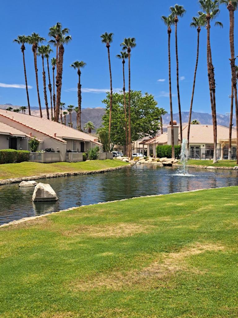 Looking for a fully renovated condo complete with newer Andersen Windows and slider, newer HVAC system & water heater, and updated kitchen and bathrooms this is the one! Second floor unit with amazing south and western mountain views and tranquil pond from your private balcony. The living room has a custom updated cozy fireplace. Every room offers a completely different view with custom blinds and drapery. This unit also includes full size washer and dryer for convenience and assigned covered parking in front of the complex. The low HOA fee of $400 covers all grounds, exterior, roofs two pools and spas, volleyball courts, a fitness center along with a club house. This home is mostly furnished with few exceptions so you can enjoy on the very day you close escrow. Perfect for a full-time resident or seasonal long term rental with shopping, dining, and entertainment on El Paseo. Palm Lake is guard gated from 8am to 4pm with security code entry for your security. Come check this one out!