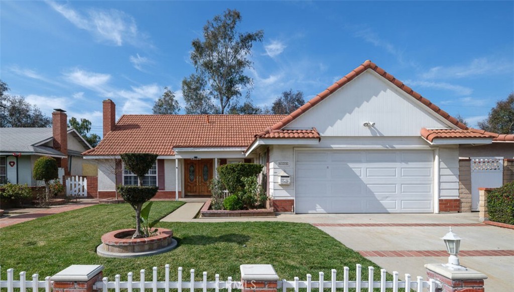 **Charming 3 Bedroom, 2 Bathroom Home for Rent in Avocado Heights** Welcome to this turnkey single-story home located in the highly desired Avocado Heights neighborhood, directly adjacent to the California Country Club golf course. This lovingly maintained and updated residence boasts excellent curb appeal with its tile roof, beautifully manicured landscaping, and charming picket fence. Situated on a peaceful cul-de-sac, the location is absolutely ideal for those seeking tranquility. Step through the double doors into an open floor plan that seamlessly flows from the entry to the light-filled living room and onward to the dining area. The living room features hardwood floors, elegant moldings, baseboards, and a cozy fireplace, creating a warm and inviting atmosphere perfect for relaxing or hosting gatherings. The dining room, with its sliding doors, offers a picturesque view of the lush greenery in the backyard, enhancing the indoor-outdoor living experience. The updated kitchen is a chef's delight, featuring newer appliances, cabinets, counters, and additional pantry space. The backyard is an entertainer's dream, with a ranch-style overhang providing a breezy, shaded area ideal for alfresco dining and socializing. Multiple bonus sheds throughout the backyard offer ample storage space. This home is sure to meet all your needs with its fantastic location and impeccable condition. Don't miss the opportunity to make this wonderful house your new home. Contact us today to schedule a viewing! Gardening maintenance is included.