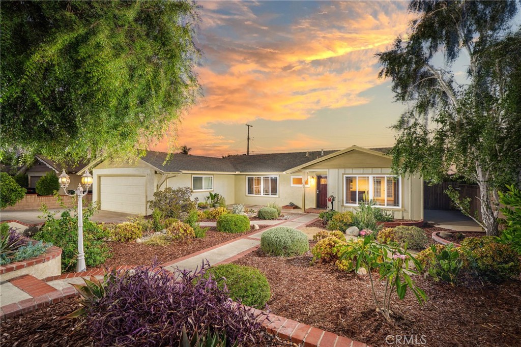 UPDATED 4 BEDROOM OPEN CONEPT HOME. From the moment you arrive, you're greeted by a beautifully landscaped front yard with drought-tolerant plants and fragrant fruit trees. Step through the front door into a spacious living room with rich wood floors and a large picture window that frames the garden and fills the room with natural light. Just beyond, a generous open-concept space offers the flexibility to be used as a formal dining area, a cozy family room, or both—perfect for hosting or everyday living. French doors lead you outside to a private backyard retreat complete with a covered patio, storage shed, and a separate, fenced lawn—an ideal setup for kids, dogs, or weekend gatherings. The kitchen has been tastefully remodeled with dark wood cabinetry, granite countertops, a large center island for prep or casual dining, and a walk-in pantry that adds incredible storage. Down the hall, you’ll find four comfortable bedrooms and two remodeled bathrooms, all neatly separated from the entertaining spaces to give everyone a sense of privacy. Additional highlights include: dual-pane windows throughout, central air and heat, a newer water heater, and a fully replaced sewer line (2020). The garage even offers a surprise bonus space—perfect for crafting, working from home, or weekend projects. Located in a quiet pride-of-ownership neighborhood with easy access to parks, trails, and historic Downtown Upland, this home offers the best of suburban comfort with a thoughtful, livable layout.