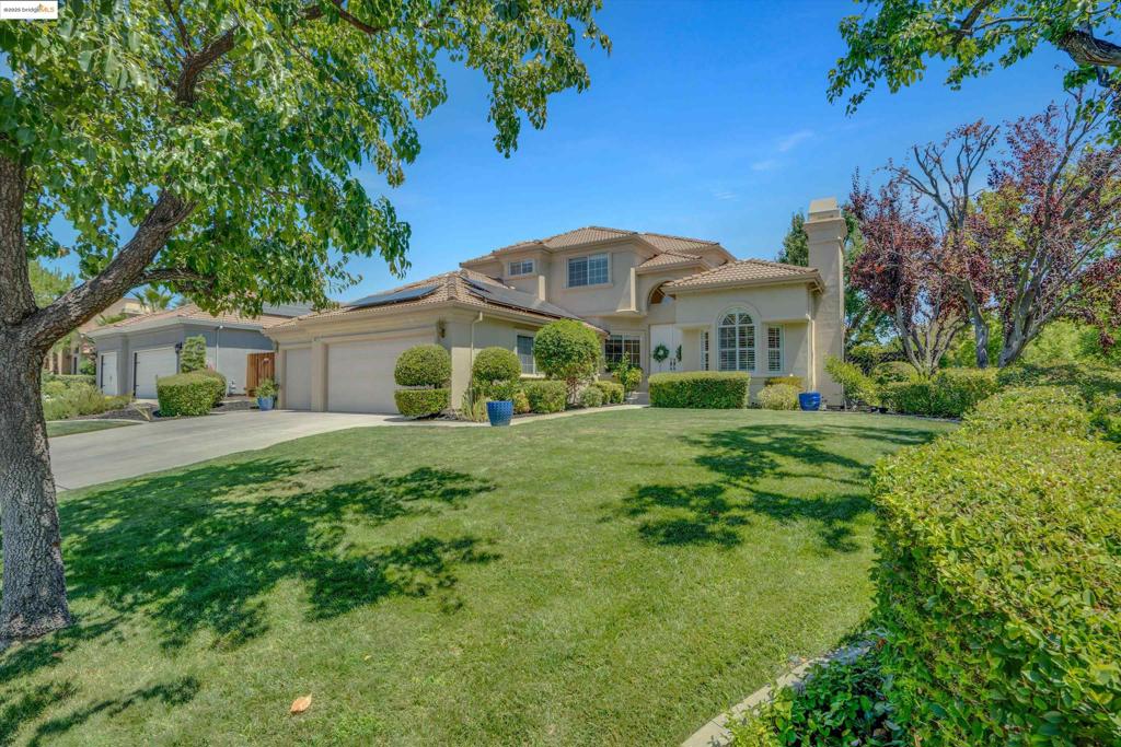 Located on a desirable corner lot behind the gates of Apple Hill Estates, this beautiful 4-bedroom, 3-bath home blends space, comfort, and style. Highlights include engineered wood flooring, plantation shutters, vaulted ceilings, nightlight feature lighting, a first-floor air filtration system, water softener, solar, and whole-house fan. The main level features formal living and dining rooms, a spacious family room with a cozy fireplace, and sliding doors leading to a covered deck and private backyard. The rear-facing kitchen offers granite counters and backsplash, breakfast bar, nook, pantry, and abundant cabinetry. A downstairs bedroom and full bath are perfect for guests or multi-gen living. Upstairs you'll find more bedrooms, a guest bath, and a large primary suite with vaulted ceilings, walk-in closet, dual vanities, sunken tub, and stall shower. A generous laundry room adds convenience with upper/lower cabinets, sink, and folding space. Enjoy a private backyard with mature landscaping and patio. Apple Hill Estates offers a pool, spa, clubhouse, tennis/pickleball and basketball courts, year-round events, and 24-hour guarded gate. Welcome home.