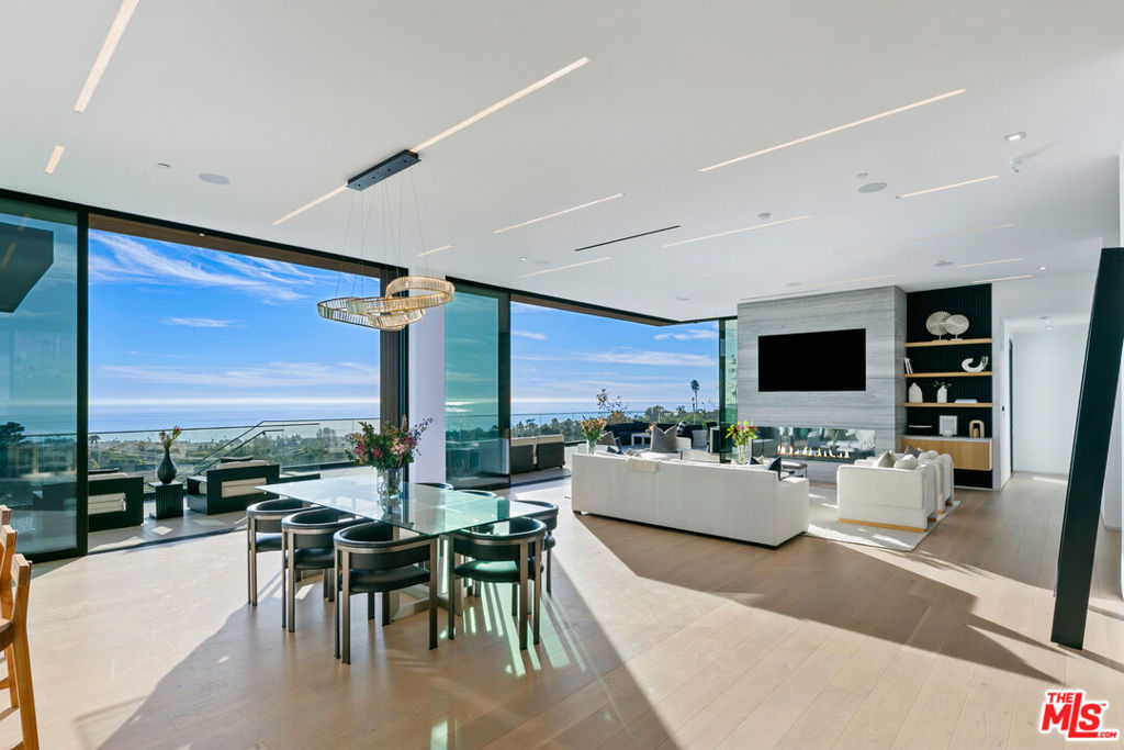 Be the first to live in this luxury, newly constructed residence with panoramic ocean views in Malibu! Located on roughly one and a half acres useable acres, this exquisite 6,782 square-foot estate, including a guest house and spacious three-car garage, offers an unparalleled coastal compound, all in close proximity to the Malibu schools, Zuma beach and miles of hiking trails. With five generously-sized bedrooms and seven and a half bathrooms, this elegantly designed trophy property offers ample accommodations and resort-style amenities for hosting and entertaining visiting family and friends. As you enter through the oversized, glass pivot door, the dramatic great room with its sweeping ocean views, walls of sliding glass and a stunning built-in bar, a focal point for unforgettable gatherings, immediately captivates you. Next to the adjacent towering wine wall, an expansive kitchen is a chef's dream come true with two center islands and gourmet appliances including a six-burner stove, double ovens, built-in espresso maker, microwave and touch-open sub-zero refrigerator and freezer. Flowing seamlessly from the kitchen, is the striking ocean view dining area and spacious living area beyond, complete with built-in flat screen and linear fireplace, all opening up to an entertainer's patio. The primary bedroom suite offers a retreat within a retreat, boasting two luxurious bathrooms and individual walk-in closets, providing the ultimate in privacy and pampering. The entertainment possibilities overflow at this majestic property. Gather with friends around the ocean view fire pit, overlooking the pool and spa. For active lifestyle aficionados, a dedicated pickleball court awaits your next game and the dedicated poolside gym beckons you to work out. Spacious patios throughout provide the perfect setting for front row seats to the stunning ocean views. A flat grassy area at the west end of the property is ideal for swing sets or outdoor activities, while the impressivegated entry and expansive driveway ensure ample parking for guests. This contemporary estate offers everything you could desire in a luxury property. With its sleek stone finishes throughout and thoughtfully designed spaces, it is a haven for those who appreciate the finer things in life. Don't miss the opportunity to lease this extraordinary property! Lease term to be 15 month minimum.