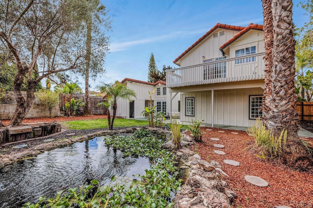 Tucked on a private cul-de-sac in one of Encinitas’ most desirable locations, on a 10,282 est.sq.ft. lot, the residence lives as a single story - with 3bd/2ba on main level, complemented by a permitted 1bd/1ba ADU on the second level with a full kitchen, living room, walk-in closet, and large balcony. All overlooking the spacious backyard w/ mature greenery, a tranquil koi pond and a patio ideal for indoor-outdoor entertaining. Just minutes from beaches, shopping, and local dining, this home blends coastal convenience with relaxed, comfortable living. Freshly painted interior with LVP flooring, the main living area welcomes you into a flexible open-concept layout that combines the kitchen, dining, and family spaces. The kitchen includes Quartz countertops, a center island, garden window, and newer appliances. The primary suite features French doors to the backyard, a spacious closet, and a versatile bonus room perfect for a home gym or private office. The ensuite bath offers dual sinks, a soaking tub, skylight, and separate shower. Generously sized secondary bedrooms and a full hall bath with dual sinks complete the main level. Additional highlights include a two-car garage, an “art studio” or extra storage space in the back, fresh exterior paint, and new gates and side fencing. No Mello-Roos or HOA!  Located within top-rated Encinitas and San Dieguito school districts, this home embodies the best of coastal North County living. Buyer and buyer’s agent to verify all in MLS prior to COE.