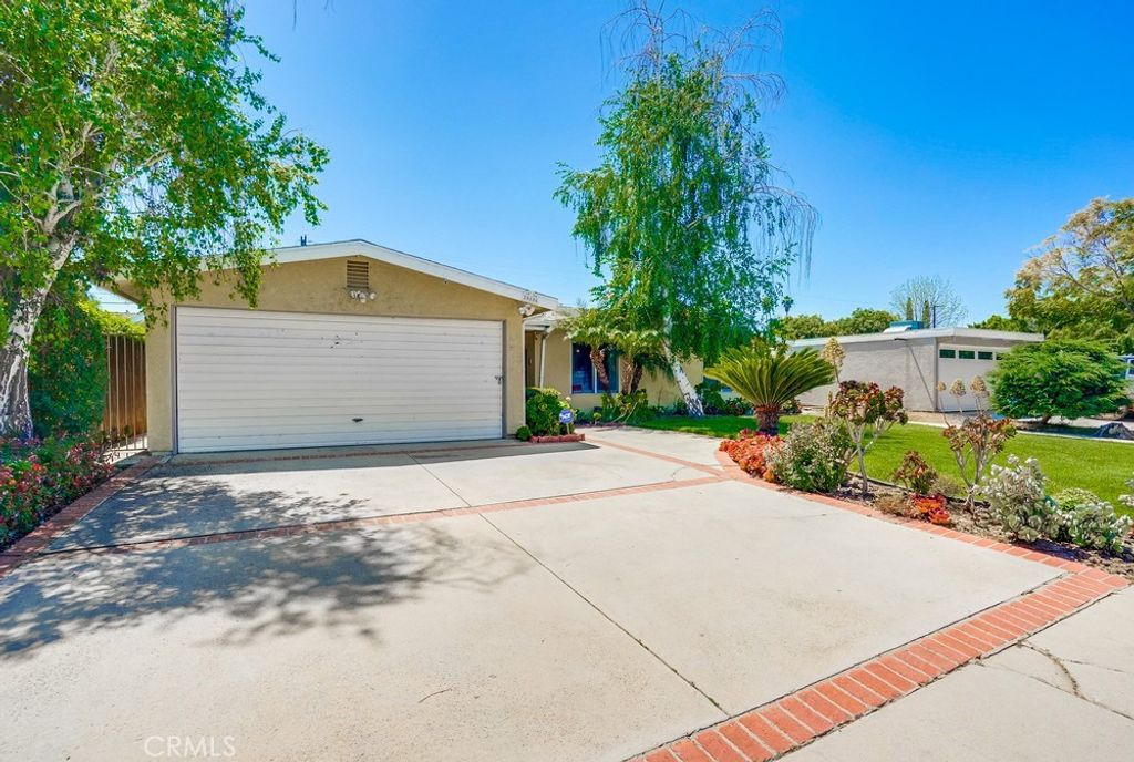 Photo of 20606 Skouras Drive, Winnetka, CA 91306 (MLS # OC25250237)