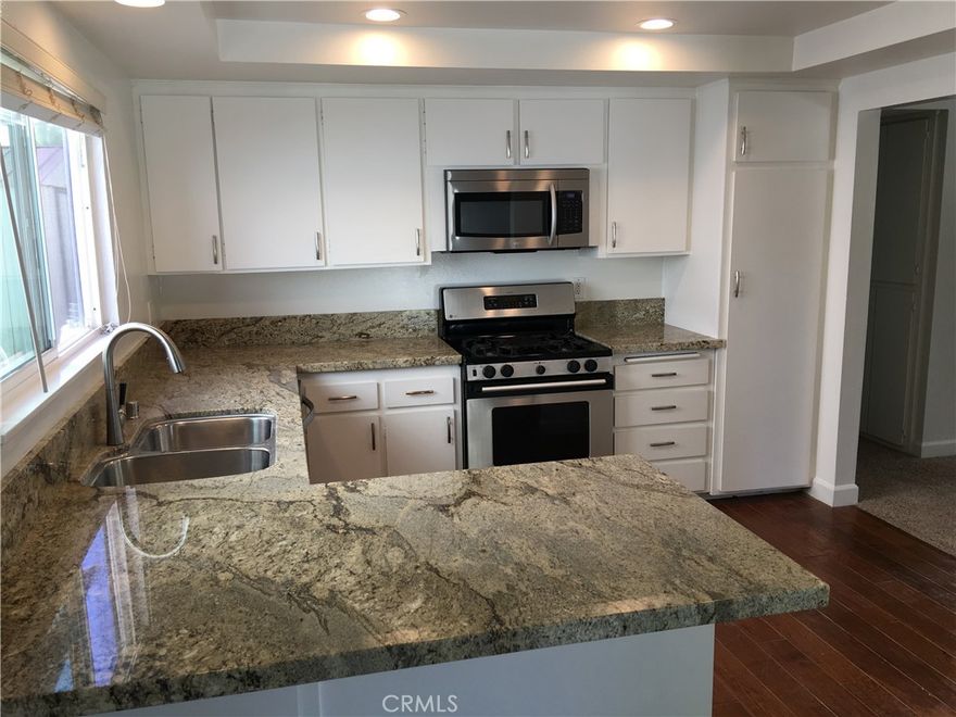 Beautiful 2 bedroom 2 bath lower unit with granite kitchen countertops, a breakfast bar, gas oven/range, refrigerator, dishwasher and microwave. This unit is light and bright with wood flooring in the kitchen and dining area and new carpet in the living room and bedrooms. Private covered patio off the kitchen and a 1 car garage with new garage door opener. Washer/ dryer are included and 1 additional parking spot in front of garage. Close to Capo Beach, parks, and elementary school. Must view property to apply. NO PETS. NO SMOKING.