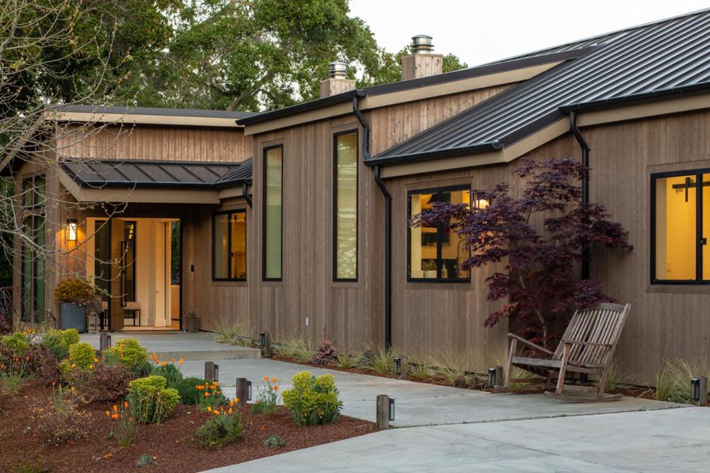 Welcome to this exceptional retreat atop a private, secluded 2.18 ac property with signature views of Windy Hill. Completed in 2019, this custom, contemporary masterpiece blends seamlessly into the surrounding natural beauty w/ a wood exterior and standing seam metal roof. Attention to detail evident at every turn, beginning with the pivoting black oak front door and continuing inside where white oak defines the floors, cabinetry, doors & accents walls/ceilings. The result is a captivating organic feel embodying the essence of the Portola Valley lifestyle. Thoughtful floor plan arranged mostly on 1 level w/ 6 bds, including an upstairs 2 bd guest apartment w/ kitchen. Formal venues, a tremendous great room, plus an office offer flexibility of use. Outside, the grounds are equally enchanting w/ a sparkling pool, fire pit, bocce court, pergola, veg garden & chicken coop. Fleetwood doors open fully for indoor outdoor experience. Truly impressive.