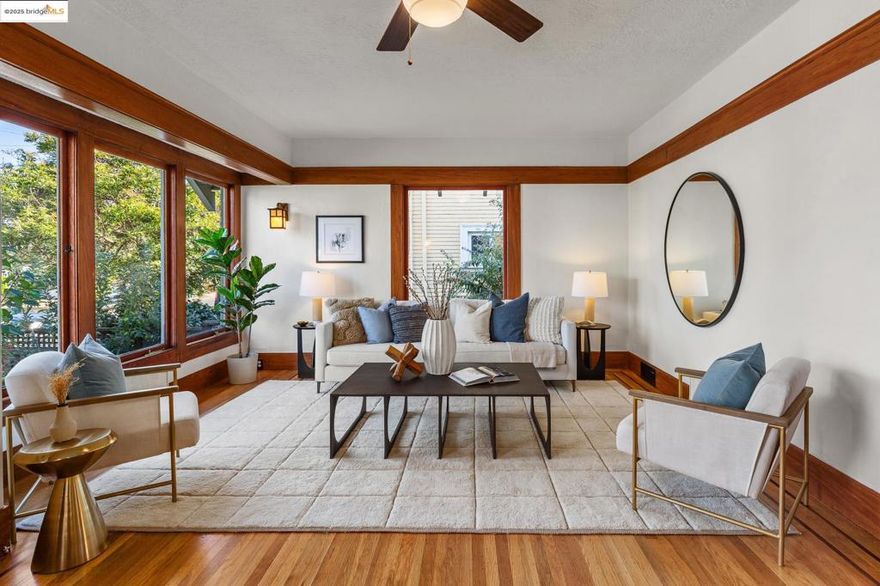 Gorgeous hidden Craftsman oasis in the heart of Temescal just moments from neighborhood favorites. Greenery & patios surround the home—perfect for morning coffee, gardening and entertaining. An enclosed foyer welcomes you into a light-filled main level with big windows and warm wood detailing throughout. Spacious living spaces flow into each other and lead into the kitchen with high-end Viking appliances, where two sets of glass doors connect seamlessly to the deck and beyond. Two spacious bedrooms and two full bathrooms are complemented by a finished attic that can be used as a play- or reading room. With its own external entrance, the non-conforming basement offers flexible space for guests or home office and has its own full bath. Spacious detached studio with full bath expands for unlimited options. With planter beds and a generous parking pad, this home balances tranquility with convenience in a vibrant neighborhood.