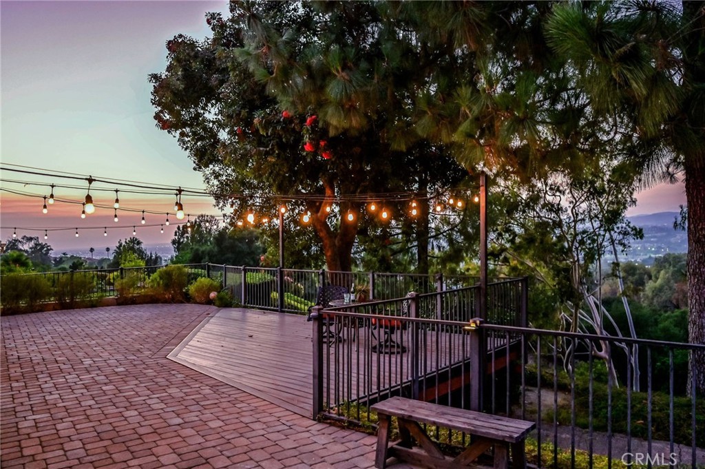 Stunning Panoramic Views from 4-Bedroom Single Story with No Inside Steps! Approx 2,271 Square Feet All on One Level ... this Beautiful Move-in-Ready Broadmoor Home is Surrounded by Nature & Gorgeous Views of City Lights, Green Trees & Snow-Capped Mountains - Spacious Open Floorplan has High Vaulted & Beamed Ceilings with 4 Skylights & Recessed Lighting Throughout - Charming Gated Front Courtyard has a Private In-Ground Spa with Soothing Rock Waterfall - Impressive Double Beveled Glass Entry Doors Open to Elegant Upgrades Including 8" Crown Moldings, Wood-Paneled Walls, Travertine & Engineered Hardwood Flooring, Plantation Shutters & More - Formal Living Room has Fireplace with Mantle & Hearth - Formal Dining Room - Two Oversized Sliding Glass Doors Invite the Outdoors In - More Sweeping Views from the Kitchen Equipped with Wood Cabinetry, Corian Countertops, Breakfast Eating Nook & Newer Appliances, Including Microwave, Dishwasher, Trash Compactor & Electric Dual Oven/Cooktop - Kitchen is Open to Family Room with Entertainer's Wet Bar - Double Door Entry to Primary Suite with Dual Closets & Window Seat - Primary Bathrooms Offers Dual Granite Vanities & Large Walk-In Shower - 3 Additional Bedrooms All Have Ceiling Fans & Mirrored Wardrobes - Updated Hall Bathroom with Granite Vanity & Tub/Shower, Plus 1/2 Bath Powder Room for Guests - Convenient Inside Laundry Room with Storage - Attached 2-Car Garage has Access to the Home Through the Courtyard - Low-Maintenance Artificial Turf & Landscaping in the Front Yard - Handsome Belgard Pavers, Plus Trex Composite Deck in the Backyard, the Perfect Spot for Outdoor Dining & Entertaining - Water Softener System - Newer Water Heater (2024) - Newer Roof (2023) - Updated HVAC System - Nearly All Newer Dual-Pane Windows - Low $202/month HOA Dues to Enjoy Assoc Spa, Two Community Pools (one is just across the street) Tot Lot Playground & Beautifully Maintained Greenbelts - No Mello Roos Tax - Just Minutes from Top-Rated Schools, Shopping, Dining, Walking/Hiking Trails, Golf Course & Walnut Canyon Reservoir