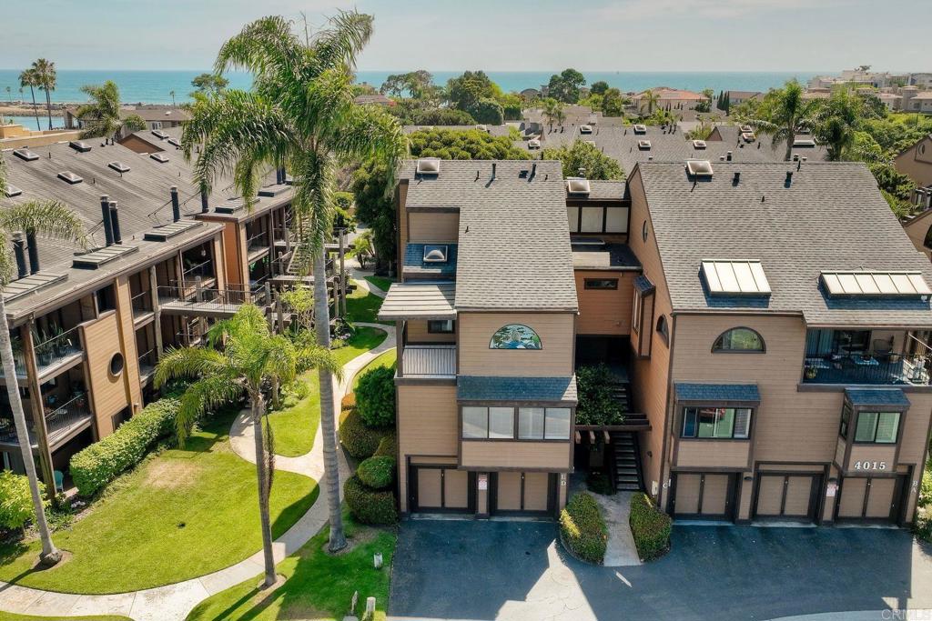 Nestled in a Gated Community just Steps from the Pacific Ocean this Windsong Cove Condominium has beautifully appointed grounds. 2 Primary Bedrooms with en-suite bathrooms, 2.5 total baths and 1,664 Square Feet of Living Space. This second floor Condominium has a Spacious entry level Living Room & Dining Room with a Fireplace & great Natural Light! The Primary Bedroom Suites have Soaring Ceilings and Abundant Light. One Bedroom has a circular stairway up to an additional Loft Space. This unit has a private 1-Car Garage and 1 additional reserved parking space (Space #101). Come put your designer touches on this diamond in the rough. The Unit has been freshly painted and the carpeting is new! Large back patio with sit down views over the spectacular grounds with fountain, lazy river, and a pool area. There are 2 spas in the complex - one located just steps from this unit. Walk just a few blocks to Tamarack State Beach. Walk to the Lagoon, the Seawall, and just a short stroll to wonderful Carlsbad Shops & Dining! Trust Sale, trustee has limited information. HOA Fees ($594 per month) and no Mello Roos. Come Live the Beach Lifestyle!