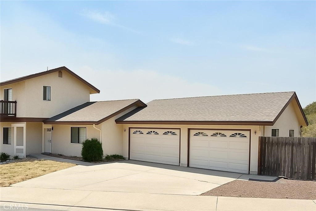 Classic 4-Bedroom Home located just minutes from the charming Village of Arroyo Grande, this 4-bedroom, 2.5-bath home sits on almost half an acre, offering space, privacy, and sweeping views from every window. Step inside and be greeted by abundant natural light and warm, inviting spaces. The family room boasts a dramatic floor-to-ceiling wood burning fireplace, perfect for cozy evenings. The kitchen offers generous cabinet space, a charming garden window, and an easy flow into the dining and living rooms — ideal for entertaining. Upstairs, the primary suite is a peaceful retreat, complete with a walk-in closet, private bath, and French doors leading to a balcony where you can enjoy your morning coffee and breathtaking vistas. The large rear deck overlooks an orchard with avocado, orange, apple, and plum trees, creating the perfect setting for outdoor dining, gatherings, or simply relaxing. Car enthusiasts, hobbyists, or anyone needing extra space will appreciate the oversized 3-car garage with a dedicated workshop area and built-in storage cabinets. This is more than just a home — it’s a place to live fully, grow, and enjoy all that the Central Coast lifestyle has to offer. Schedule your private showing today and discover your Arroyo Grande dream home!