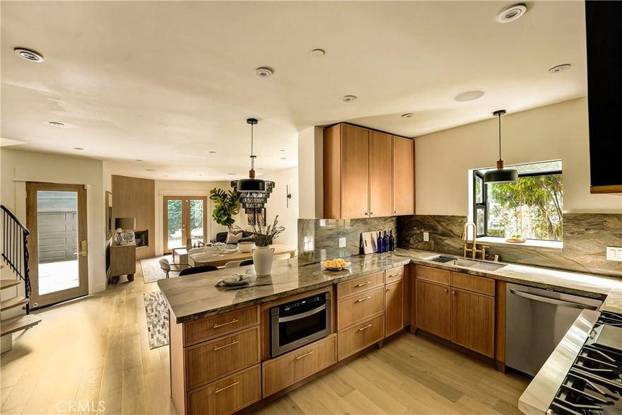 This stunning newly remodeled three-bedroom, three-bathroom home has been curated to blend modern design with organic warmth. Every detail has been thoughtfully curated to create a space that feels both sophisticated and serene. This ideally situated urban location is just a few steps to the beach, the pier, all of the dining and shopping on Main Street and the famed 3rd Street Promenade. 

The open-concept living area showcases white oak floors and semi-custom white oak cabinetry, setting the tone for an airy, natural aesthetic. The chef’s kitchen features new appliances, Quartzite countertops, and a 48-inch professional range, ideal for those who love to cook and entertain in style.

Each bedroom offers ensuite access, providing comfort and privacy for all. The primary suite is a true retreat, complete with a spa-like bath, walk-in shower, and freestanding soaking tub surrounded by elegant finishes.

Outdoors, the newly landscaped yard invites relaxation and al fresco dining. The bonus flex space/garage (currently permitted as a garage and included in the living area for informational purposes) has been tastefully designed as a studio, game room, or creative workspace, expanding your options for living and entertaining. With the home measuring approximately 1,753 square feet per the assessor and the flex space/garage adding an additional 380 square feet, this property offers exceptional flexibility. Buyer may be able to convert the flex space/garage into an ADU. Buyer to investigate and satisfy themselves with the City Planning Department.

With its blend of organic textures, modern design, and meticulous craftsmanship, this home embodies the essence of coastal elegance perfectly tailored for today’s lifestyle.