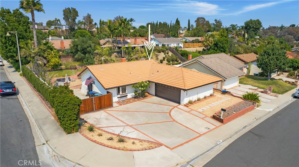The last 8,000 sq ft corner lot under $1M in Mission Viejo. Where original owners still live three doors down and homes sell via handshake before hitting the MLS. This one's different—it's actually available. 2 beds, 2 baths, 8,000+ sq ft lot. Low taxes. Tesla-ready. RV access. Lake Mission Viejo membership included. The reality: That kitchen you've been pining for - already done—custom maple, granite, stainless. Expansive Primary suite gets morning light that makes your coffee taste better. Both bathrooms? Remodeled. The enclosed Lanai works as hard as you do—office by day, wine room by night. The opportunity: While your neighbors squeeze additions onto 5,000 sq ft, you're sitting on enough land for a pool, ADU, and still have room to throw a football. The fruit trees stay. The privacy stays. Your equity grows. The location: Walk to Blue Ribbon schools. Bike to the lake for Saturday concerts. Five minutes to everything, far enough from nothing. The truth: Someone's going to build their dream here. The lot alone is worth what you'll pay. The house is move-in ready while you plan what's next. In a market where everyone's overpaying for potential, you're buying the real thing. This is the one your realtor would buy for themselves!