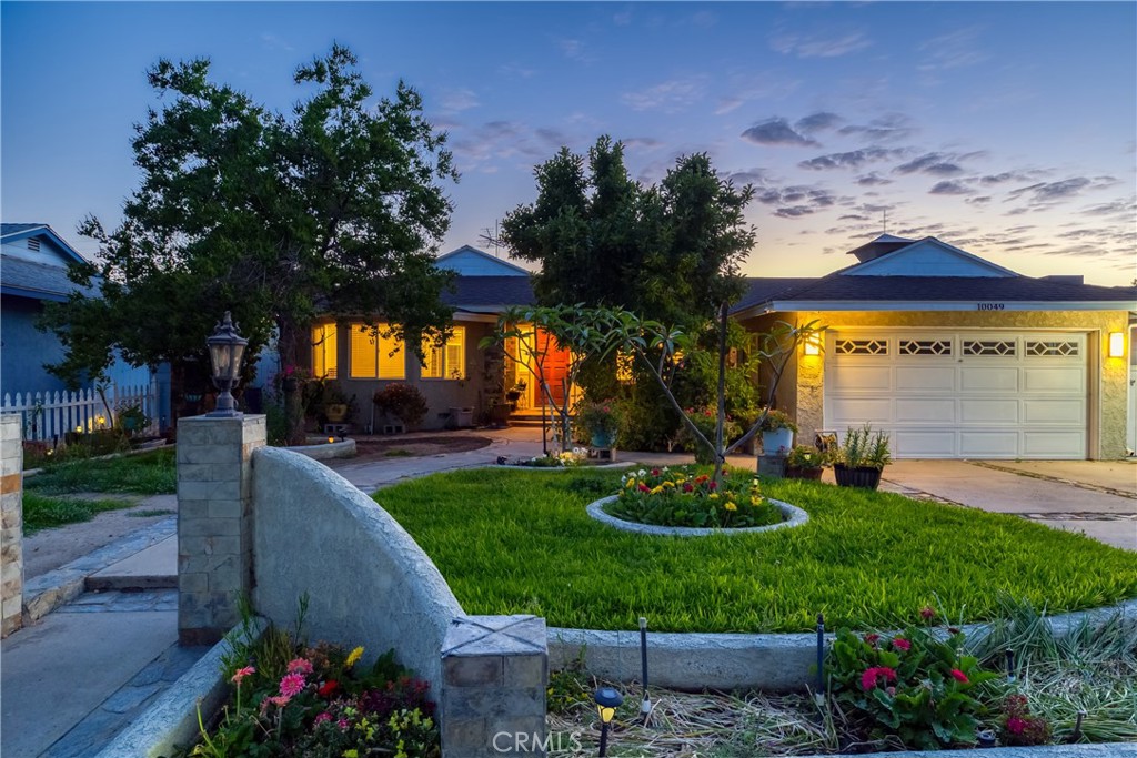 This one of a kind 2,300 square foot home sits on a generous 8,000 square foot lot. There was a family room addition that could be an in-laws area, or use it as a game room for entertaining family and friends. It has a fireplace and recessed lighting with it's own private entrance. The front room is open and brightly lit from the sunlight and recessed lights, with views of the kitchen and dining room. The kitchen has custom wood cabinetry and granite counters and recessed lighting. Plus you will enjoy serving everyone on your Granite kitchen island. The main bedroom has 2 closets and a jetted tub with marble flooring and is very spacious. The 2 other bedrooms down the hall share a full bathroom and both rooms have great floor and wall space. The backyard has an avocado tree for organic avocados. There is plenty of parking in the driveway and the 2 car garage. Enjoy the close proximity of all the stores and restaurants.