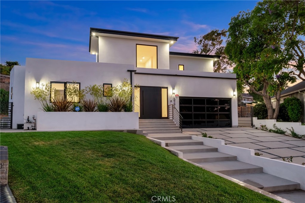 Step into luxury living with this stunning 2024-built modern residence where thoughtful design meets exceptional functionality. This 3-bedroom, 5-bathroom home features soaring 20-foot ceilings in the grand living room, a retractable chandelier, and a built-in 7-person home theatre. Outfitted with the latest smart home technology.The expansive kitchen and dining area are perfect for entertaining, featuring high-end luxury appliances, an oversized wine fridge, luxury stove with pot filler, double-wide farmhouse sink, dishwasher, oversized refrigerator, built-in microwave, and an 8-foot island with prep sink. Upstairs, the private primary suite offers a true retreat with a dedicated office, dual walk-in closets, a wet bar, peek-a-boo views, and a balcony overlooking the backyard. The spa-like primary bath includes dual vanities, a large walk-in shower with built-in bench, and premium finishes throughout. Sitting on just under 17,000 usable lot, this property offers endless possibilities — perfect for a pool/spa, ADU, sports court, or custom outdoor living space. A rare opportunity to own a fully upgraded modern home with space to expand and create.