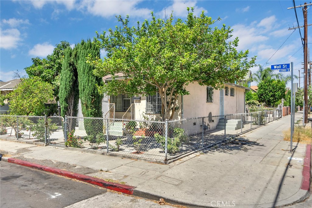 This 3-bedroom, 2-bath home offers great value and versatility - perfect for a first-time buyer or an investor looking for rental income. The kitchen was remolded 3 years ago and flows nicely with the spacious layout. The property features a large lot filled with beautiful fruit trees and includes a detached ADU at the back for additional living space or rental potential. While the area is in transition, this home is conveniently located near major highways, USC, the Natural History Museum, and the Los Angeles Fashion district. With a bit of vision, this property offers a great chance to build equity and generate future cash flow.