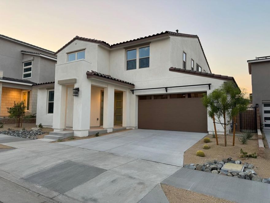 New construction 4-bedroom, 4.5-bath home with an additional private 2-room casita.Located in NOVA at University Park--one of Palm Desert's newest resort-style communities--this modern two-story home offers bright, open-concept living with seamless indoor-outdoor flow. Large sliding doors lead to a finished backyard with open sky and mountain views.The main home features a beautifully designed kitchen with a large central island, modern finishes, and generous storage throughout. The open layout connects the kitchen to the dining and living areas, creating an ideal space for everyday living or entertaining. Upstairs, the spacious primary suite includes a large walk-in closet and a luxurious bathroom with a standing shower, soaking tub, and dual vanities. The secondary suite offers its own private bathroom, perfect for guests or family. Two additional junior bedrooms with full closets share a well-designed full bathroom that includes two separate vanities for added convenience. A full-size laundry room sits on the bedroom level for easy access.The private detached casita includes a separate entrance, living/sleeping area, kitchenette with mini-fridge and microwave, its own laundry hookup, and a full bathroom--ideal for multigenerational living, long-term guests, a home office, or a next-gen suite.This home also includes full solar, a home battery system, and EV charging, offering excellent energy efficiency and meaningful savings on utilities.Residents enjoy access to The Grove, a premier resort-style center featuring multiple pools (lap, adult & kids), spas, fitness center, pickleball, bocce, fire pits, a clubhouse, and a shaded playground. Centrally located near shopping, dining, hiking, golf, and major travel routes--all within a peaceful Palm Desert setting