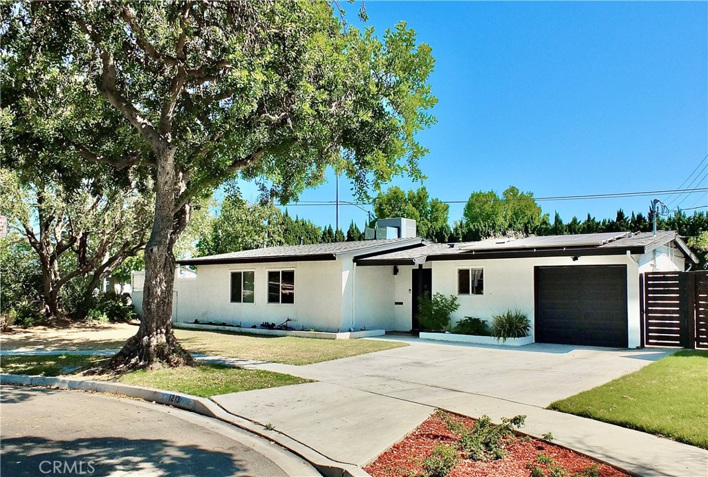 Welcome to 1213 Studebaker Road — your very own urban ranch retreat in East Long Beach
This beautifully remodeled, single-level home sits on a sprawling 8,101 sq ft corner lot and offers the ideal blend of style, comfort, and location. Thoughtfully updated in 2022, the home features luxury vinyl plank flooring, a designer kitchen with quartz countertops and shaker cabinets, newer roof, upgraded electrical panel, copper plumbing, water heater, and dual-pane windows. In 2024, custom built-in cabinets were added to the dining area for additional style and function. A Tesla universal wall connector and solar panels offer modern convenience and energy efficiency.
The home includes 3 bedrooms, 2 bathrooms, and a California Room, perfect for additional living space. Step outside to your private backyard oasis—an entertainer’s dream with an expansive lawn, pergola-covered patio, raised vegetable beds, landscape lighting, and new vinyl fencing. You'll also enjoy a bounty of mature fruit trees, including two avocado trees, apple, and lime—perfect for those who love fresh, homegrown produce. Situated just steps from the San Gabriel River Trail and canal, the home benefits from refreshing coastal breezes and a serene, open-air feel—adding to the natural charm of this East Long Beach gem.
Located near CSULB, 2nd & PCH, Naples, Belmont Shore, El Dorado Park and Golf Course, and just a short bike ride to the beach. Nestled on a quiet cul-de-sac with ample street parking, this turnkey home offers the best of Long Beach living—convenience, charm, and a lifestyle you'll love. *Please note that the grass was enhanced on some of the exterior photos.
