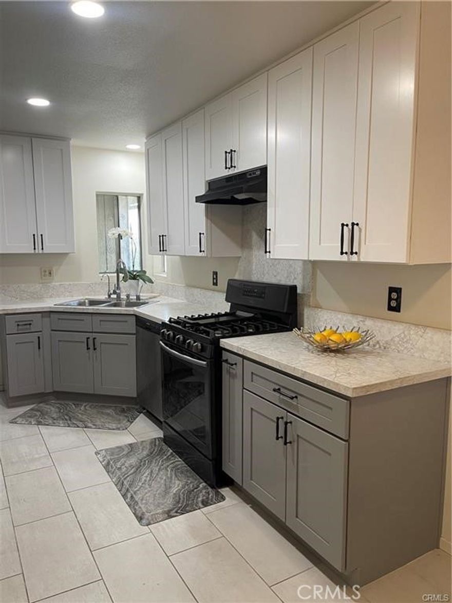 Welcome to your dream home! This newly renovated 4-bedroom, 2-bathroom gem is set on a sprawling 8417 sqft lot, perfect for families and entertaining. Experience comfort with a recently installed brand new HVAC system that ensures year-round climate control. Step inside to discover bright, fresh white paint throughout, paired with ceiling fans for a modern touch. The home features newly installed laminate flooring in all bedrooms, creating a warm, inviting atmosphere. The kitchen is a chef's delight, showcasing newer cabinetry, sleek granite countertops, and updated appliances including a stove range/hood, dishwasher, and water filter system. Both bathrooms boast exquisite porcelain tile flooring, adding a touch of elegance. Enjoy the spacious garage, complete with two closets and ample shelving for all your storage needs, plus a utility area with a washer and dryer. Venture outside to your expansive backyard, where you can relax under a large covered patio surrounded by flourishing orange, lime, lemon, guava, and avocado trees. With three patio doors leading to this outdoor oasis, you can soak in the serene views and enjoy the cool afternoon breezes. Conveniently located near the 605, 10, and 210 freeways, and within walking distance to Walmart, Home Depot, and excellent schools including Walnut Elementary and Olive Middle School. This well-maintained neighborhood offers plenty of street parking and a welcoming community vibe.

Don't miss out on this fantastic opportunity! Welcome home to a blend of comfort, convenience, and a touch of nature!